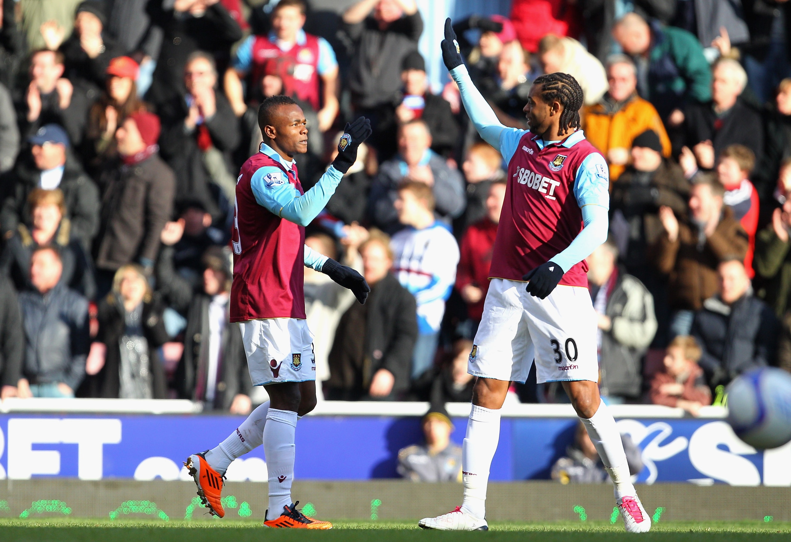 LONDON, ENGLAND - JANUARY 30:  Victor Obinna of West Ham United celebrates scoring the opening goal with teammate Frederic Piquionne (R) during the FA Cup sponsored by E.O.N 4th Round match between West Ham United and Nottingham Forest at the Boleyn Groun