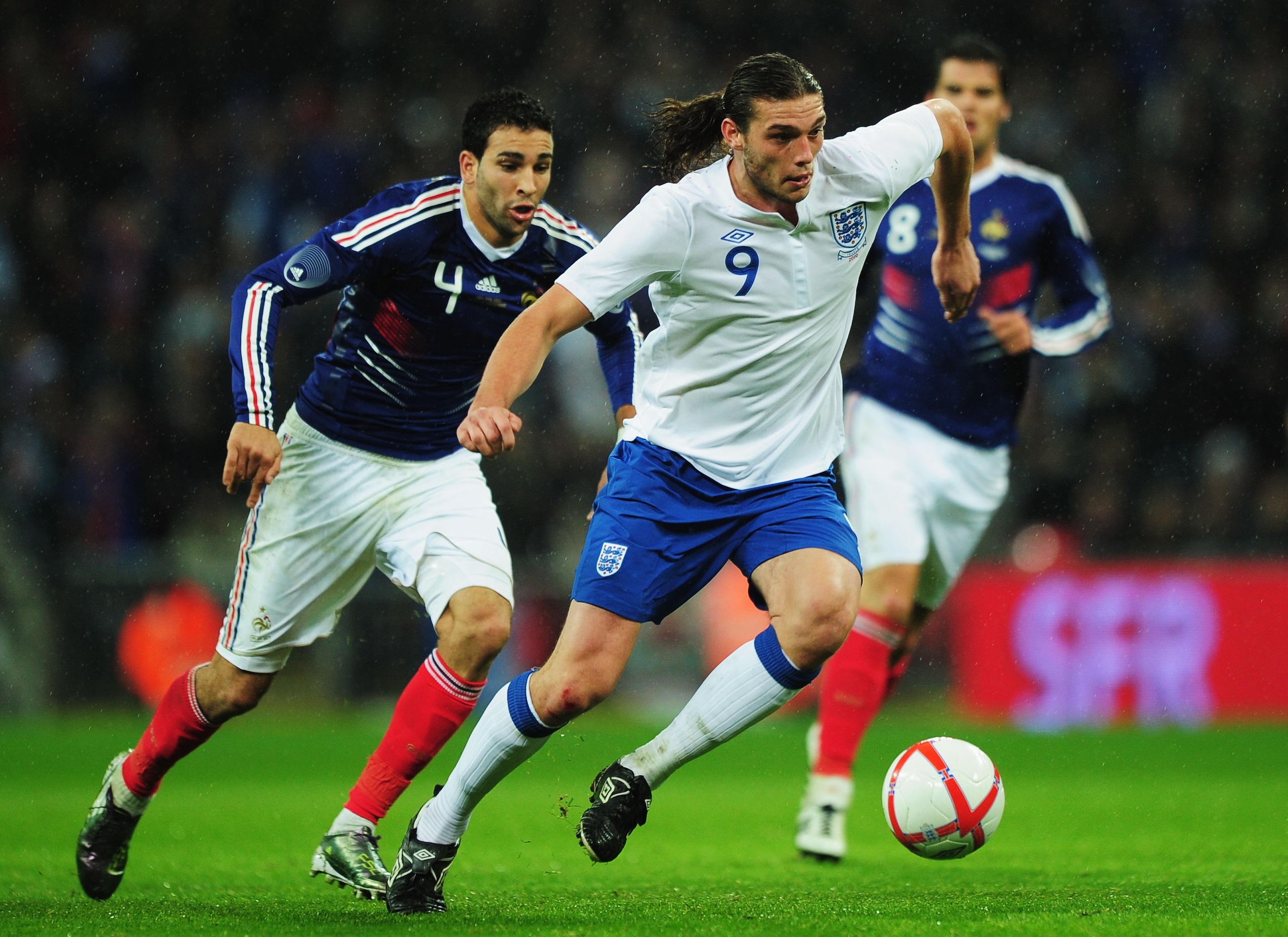 LONDON, ENGLAND - NOVEMBER 17:  Adil Rami of France watches of Andy Carroll of England during the international friendly match between England and France at Wembley Stadium on November 17, 2010 in London, England.  (Photo by Shaun Botterill/Getty Images)