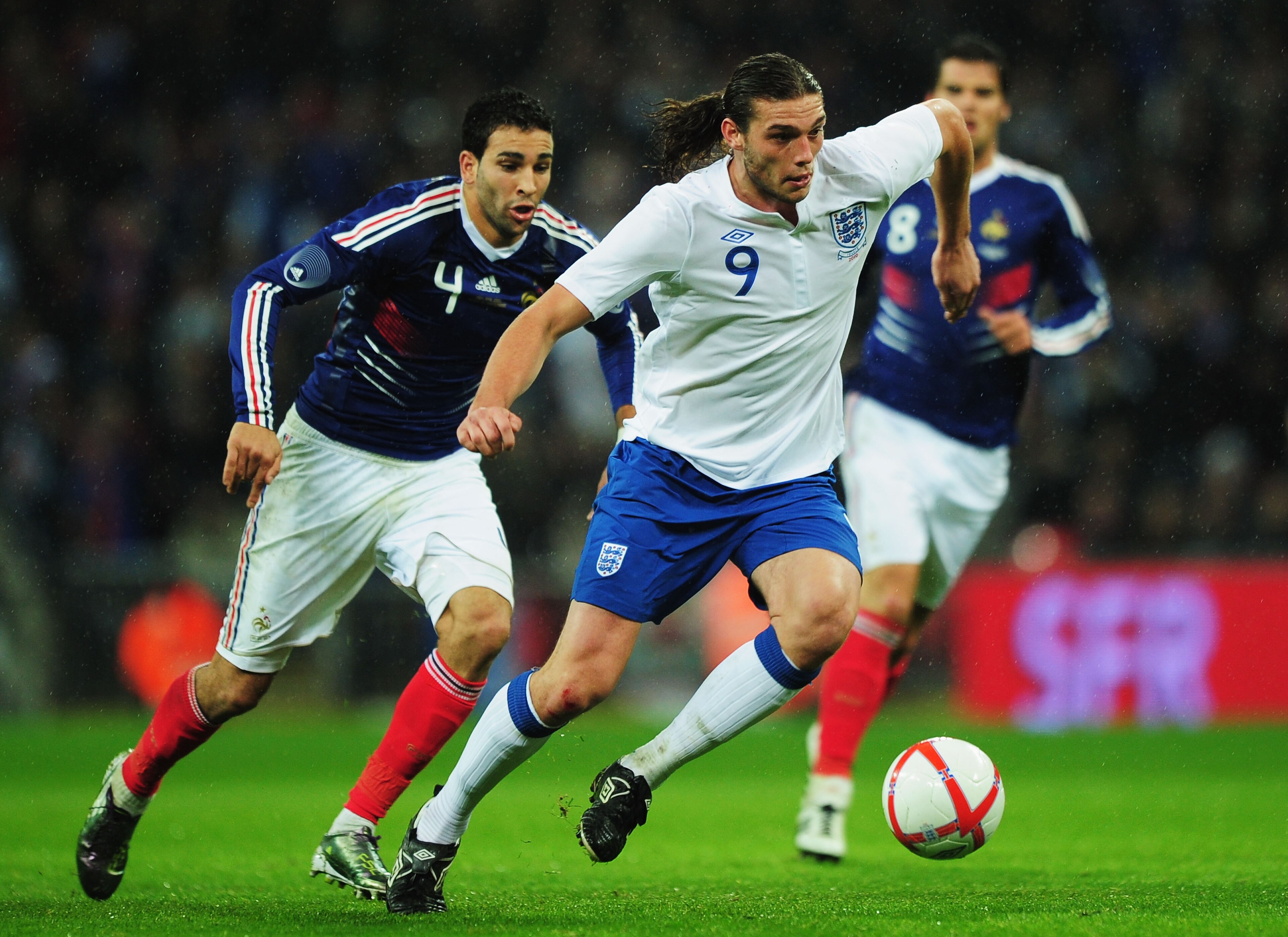 LONDON, ENGLAND - NOVEMBER 17:  Adil Rami of France watches of Andy Carroll of England during the international friendly match between England and France at Wembley Stadium on November 17, 2010 in London, England.  (Photo by Shaun Botterill/Getty Images)