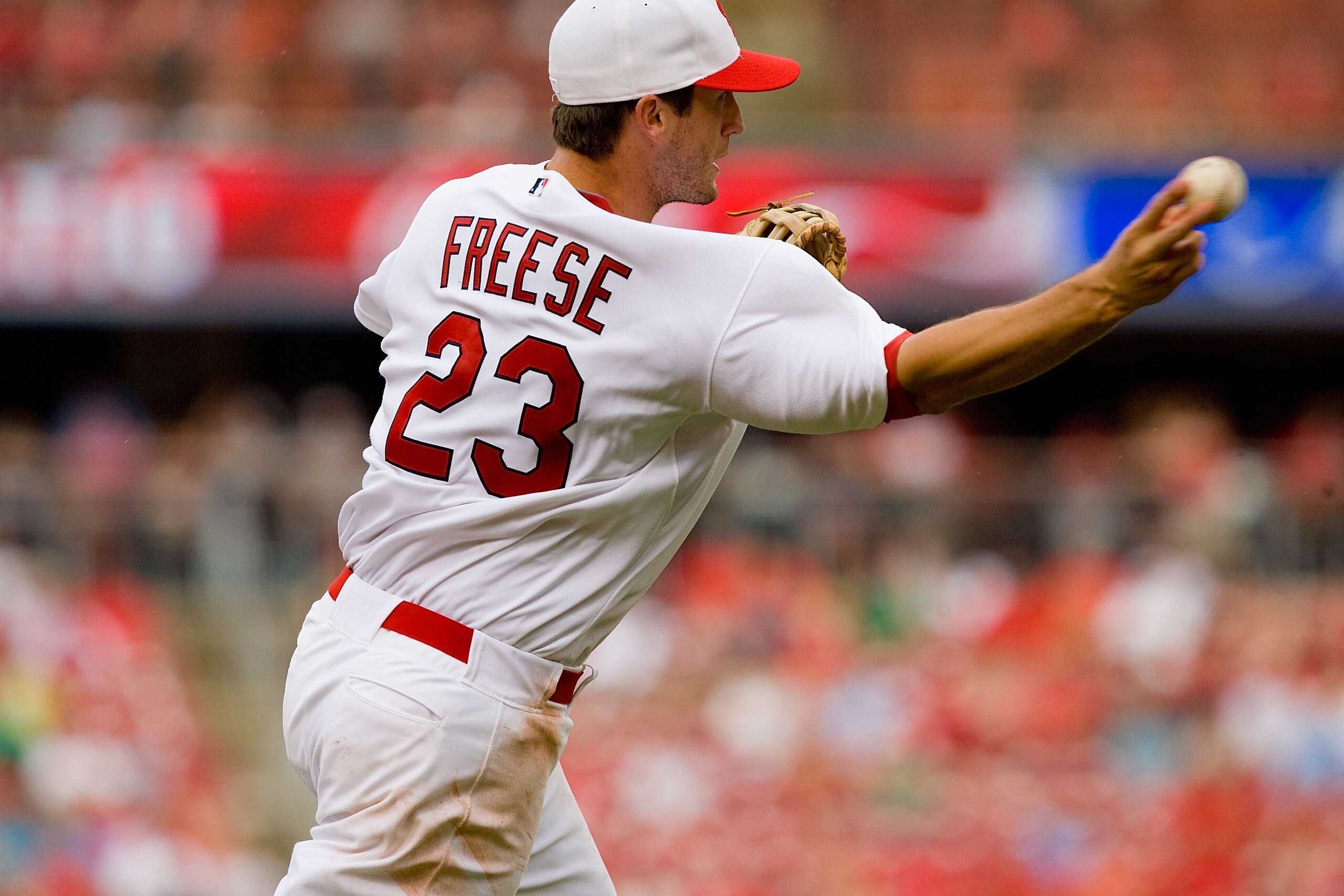 ST. LOUIS - MAY 31: David Freese #23 of the St. Louis Cardinals throws the ball during action against the Cincinnati Reds at Busch Stadium on May 31, 2010 in St. Louis, Missouri.  (Photo by Dilip Vishwanat/Getty Images)
