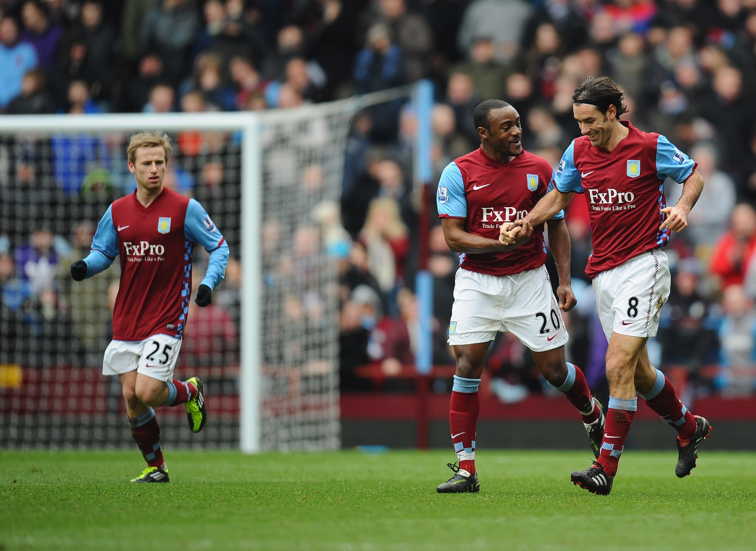 BIRMINGHAM, ENGLAND - JANUARY 29:  Robert Pires of Aston Villa is congratulated on his goal by captain Nigel Reo-Coker of Aston Villa during the FA Cup sponsored by E.On Fourth Round match between Aston Villa and Blackburn Rovers at Villa Park on January 