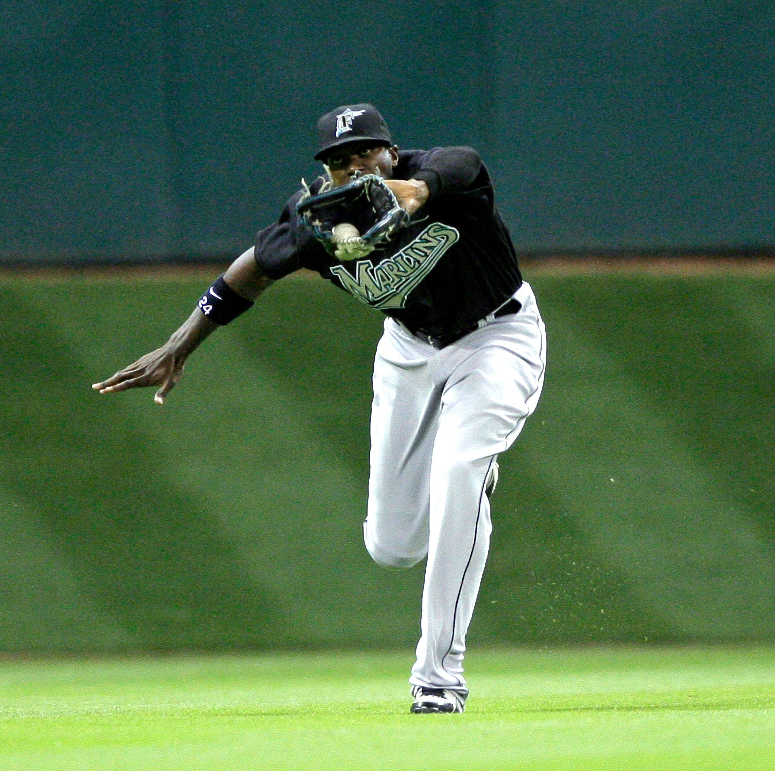 HOUSTON - APRIL 20: Center fielder Cameron Maybin #24 of the Florida Marlins makes a running catch on a ball hit by Pedro Feliz of the Houston Astros in the fourth inning at Minute Maid Park on April 20, 2010 in Houston, Texas. (Photo by Bob Levey/Getty HOUSTON - APRIL 20: Center fielder Cameron Maybin #24 of the Florida Marlins makes a running catch on a ball hit by Pedro Feliz of the Houston Astros in the fourth inning at Minute Maid Park on April 20, 2010 in Houston, Texas. (Photo by Bob Levey/Getty