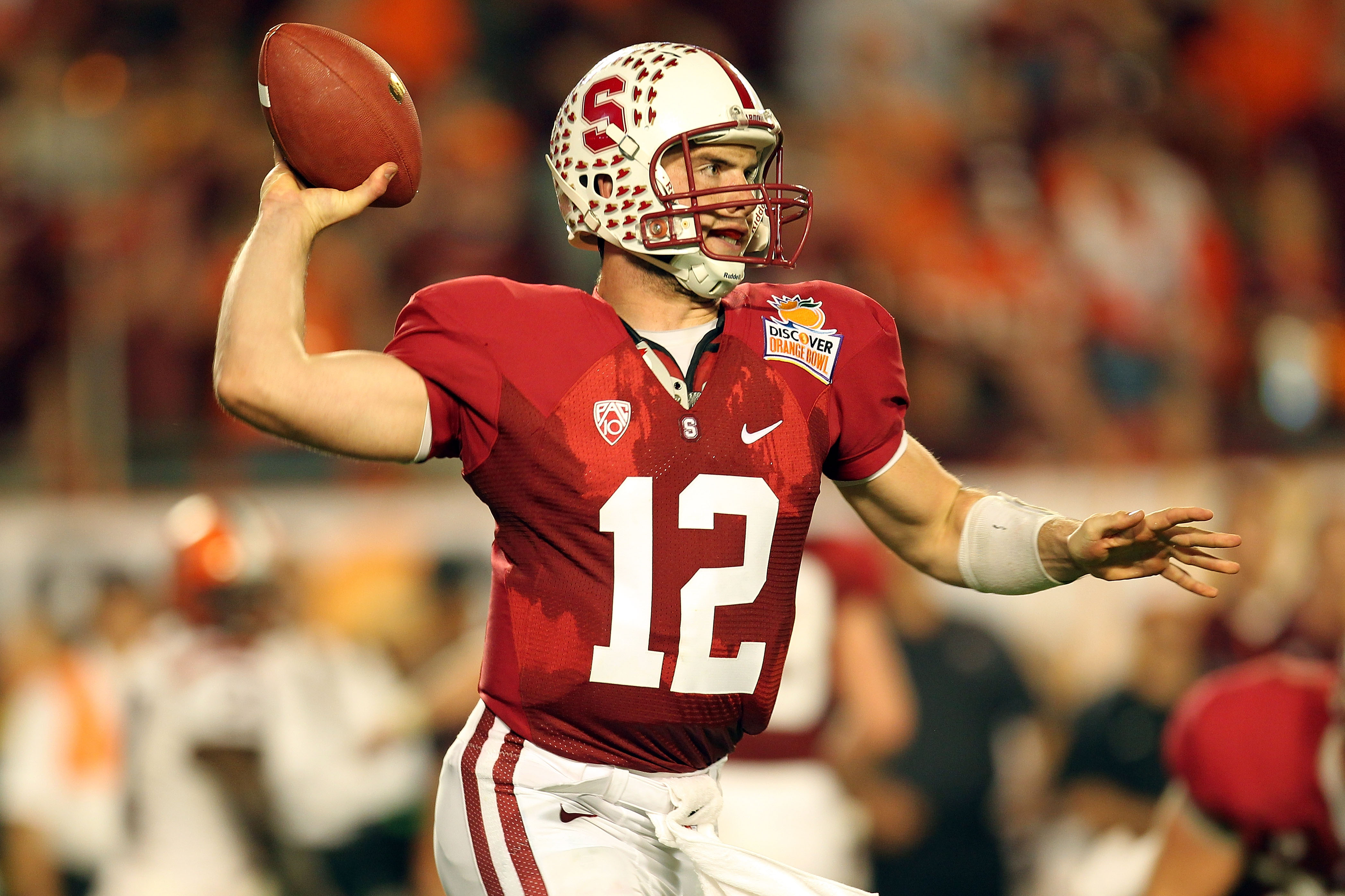 MIAMI, FL - JANUARY 03: Andrew Luck #12 of the Stanford Cardinal throws pass against the Virginia Tech Hokies during the 2011 Discover Orange Bowl at Sun Life Stadium on January 3, 2011 in Miami, Florida. Stanford won 40-12. (Photo by Mike Ehrmann/Getty