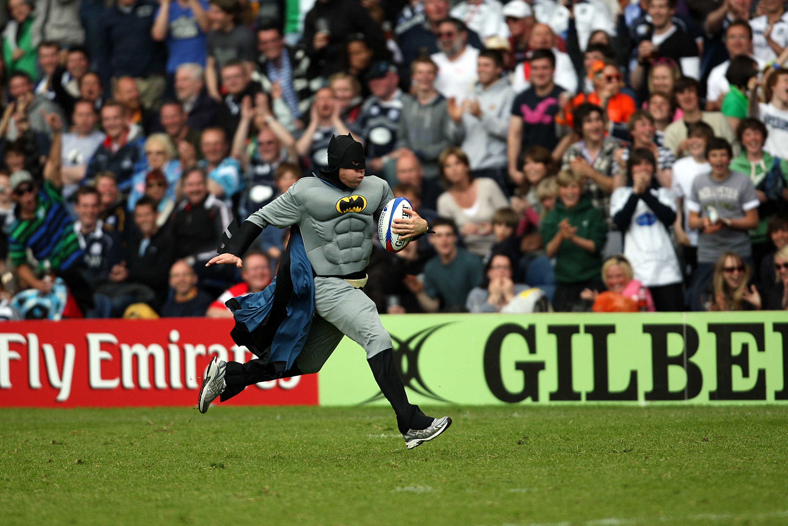 EDINBURGH, SCOTLAND -  MAY 30:A fan dressed as Batman enters the field of play before he is handcuffed and led away by Police during the the IRB Edinburgh Sevens Festival at Murrayfield Stadium on May 30, 2010 in Edinburgh, Scotland. (Photo by Ian MacNico