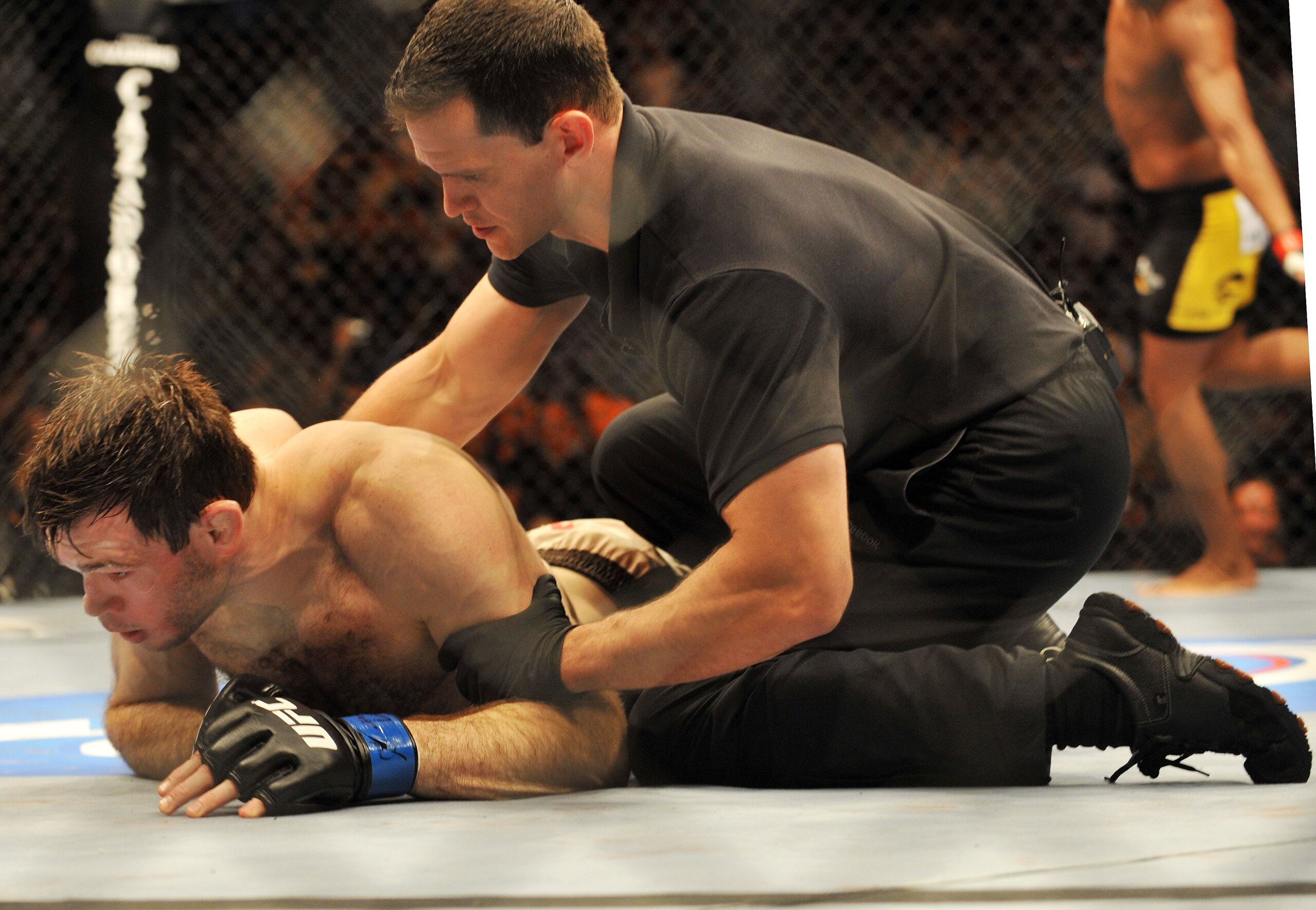 PHILADELPHIA - AUGUST 08:  (Bottom) Forrest Griffin on the ground after being defeated by Anderson Silva during their light heavyweight bout at UFC 101: Declaration at the Wachovia Center on August 8, 2009 in Philadelphia, Pennsylvania.  (Photo by Jon Kop