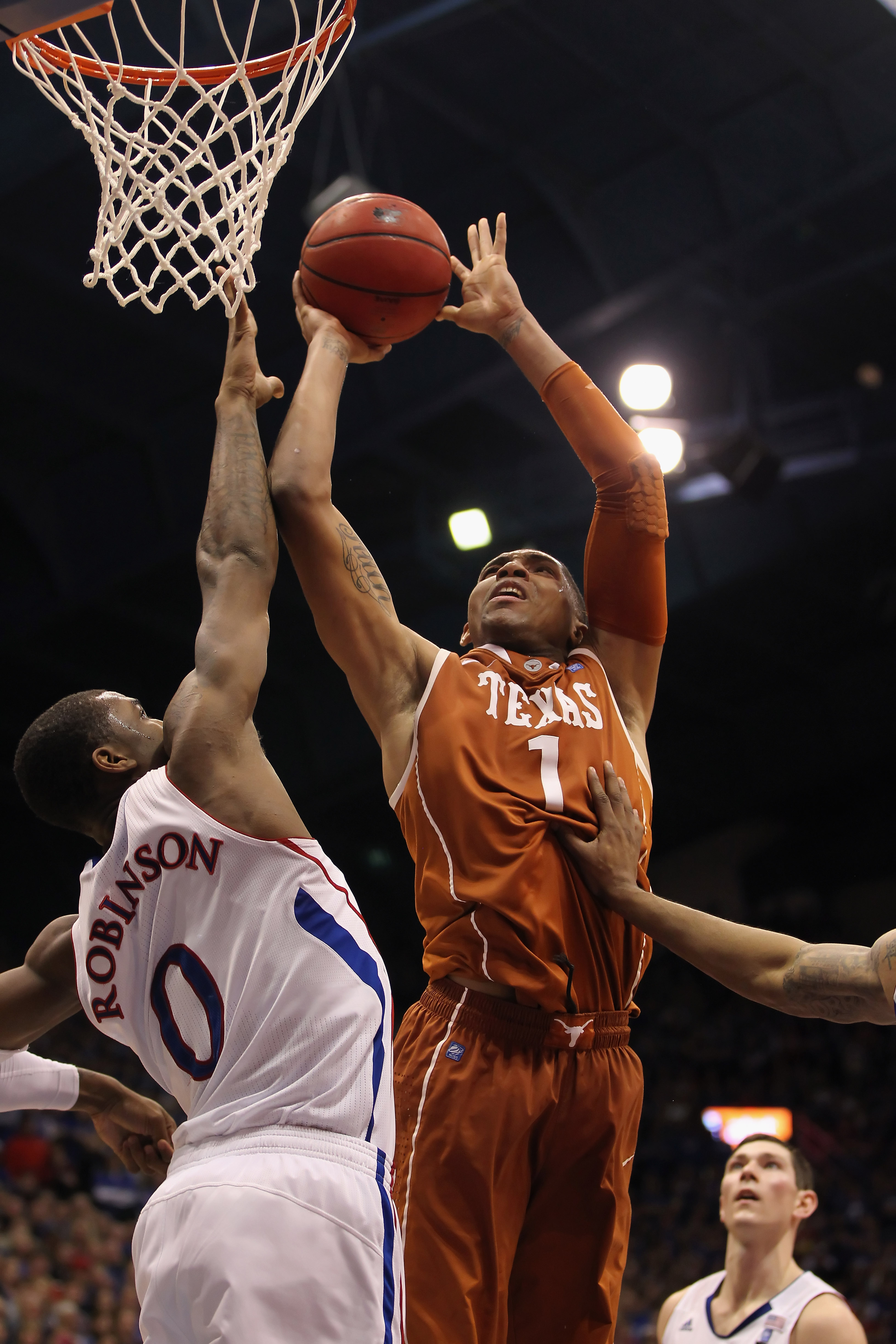 LAWRENCE, KS - JANUARY 22: Gary Johnson #1 of the Texas Longhorns shoots over Thomas Robinson #0 of the Kansas Jayhawks during the game on January 22, 2011 at Allen Fieldhouse in Lawrence, Kansas. (Photo by Jamie Squire/Getty Images)