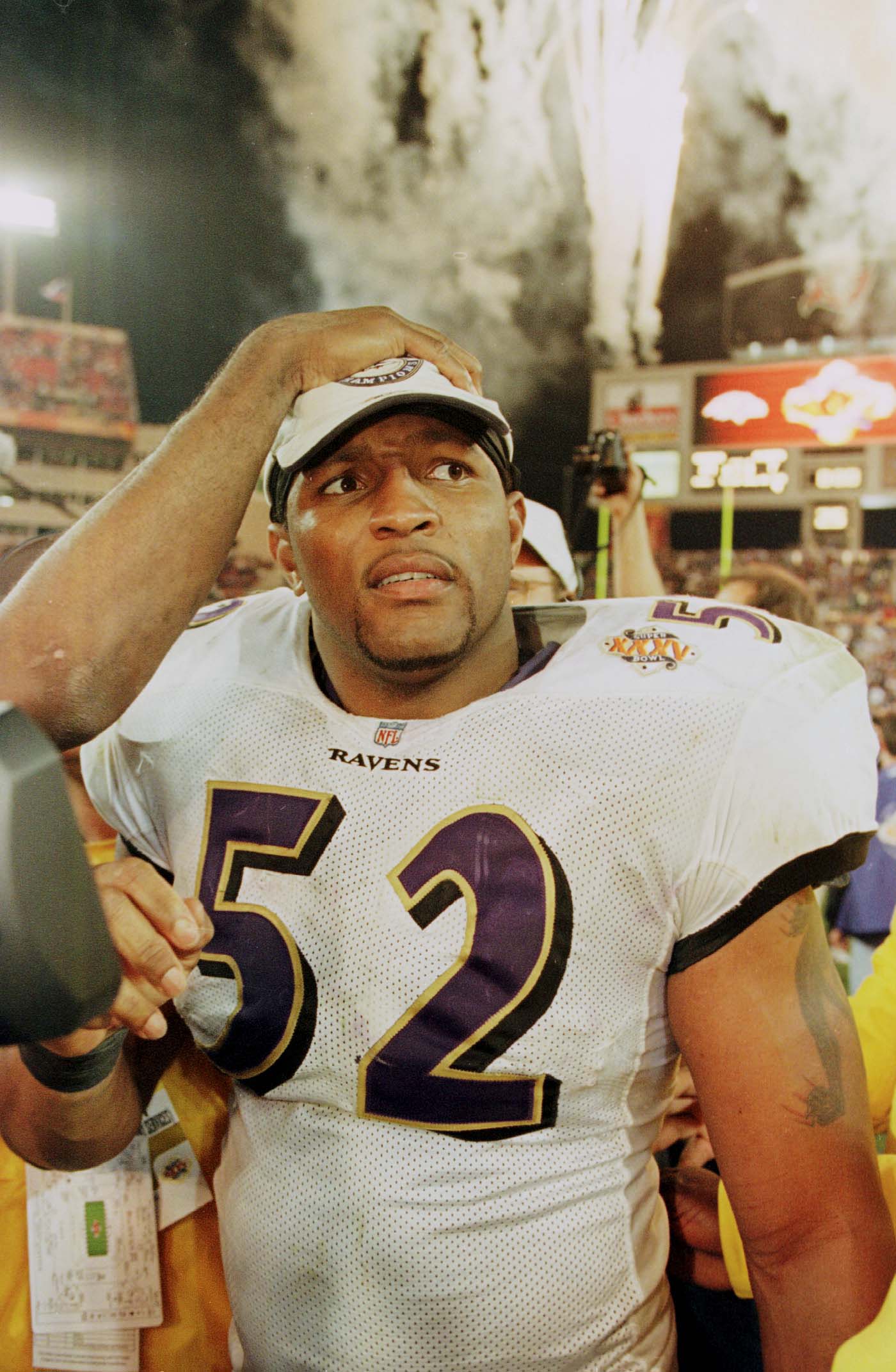 28 Jan 2001: Ray Lewis # 52 of the Baltimore Ravens gets a hand on his head after Super Bowl XXXV between the Baltimore Ravens and the New York Giants at Raymond James Stadium in Tampa, Florida. Mandatory Credit: Andy Lyons/ALLSPORT