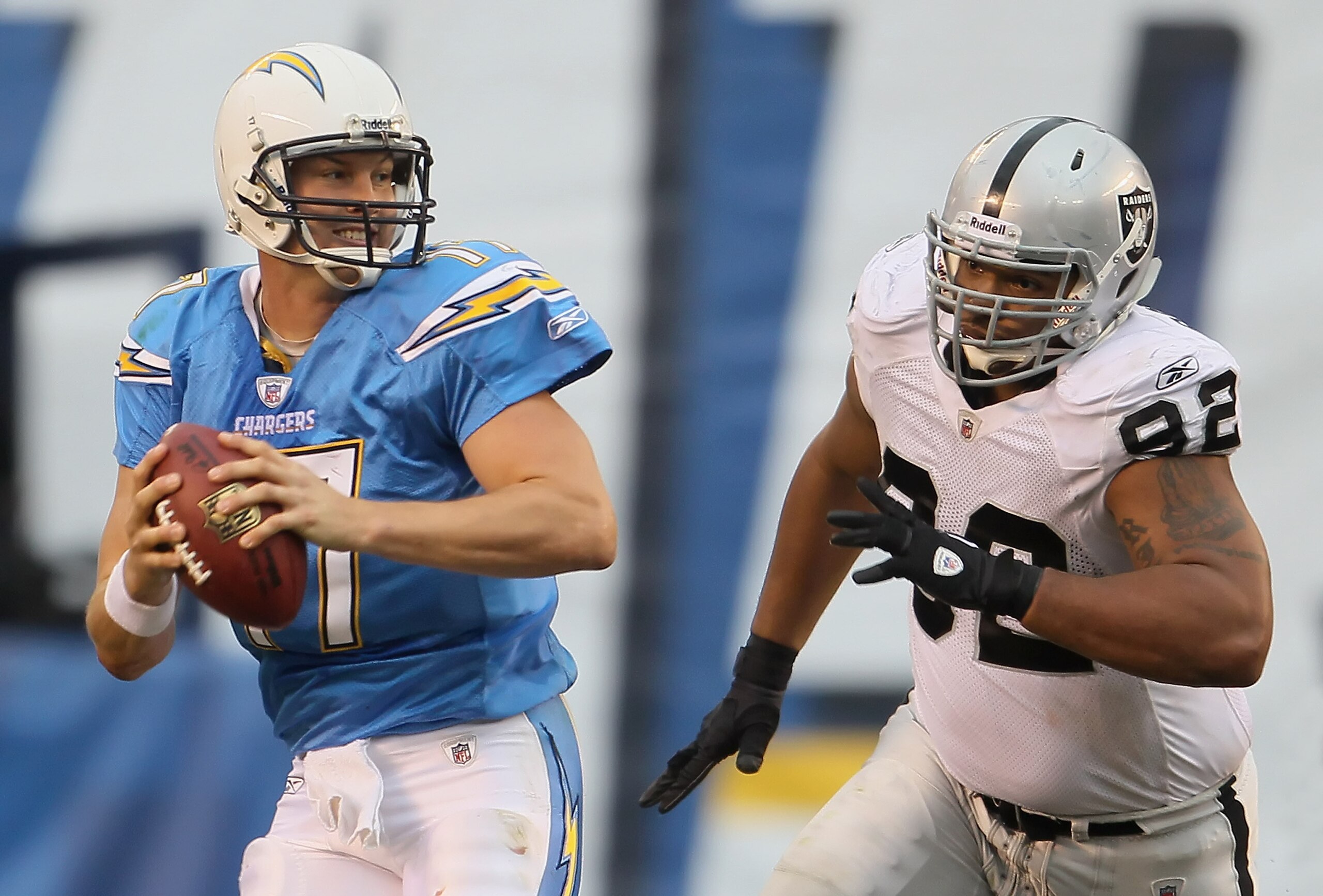 SAN DIEGO - DECEMBER 05: Quarterback Philip Rivers #17 of the San Diego Chargers is chased out of the pocket by Richard Seymour #92 of the Oakland Raiders in the third quarter at Qualcomm Stadium on December 5, 2010 in San Diego, California. The Raiders SAN DIEGO - DECEMBER 05: Quarterback Philip Rivers #17 of the San Diego Chargers is chased out of the pocket by Richard Seymour #92 of the Oakland Raiders in the third quarter at Qualcomm Stadium on December 5, 2010 in San Diego, California. The Raiders