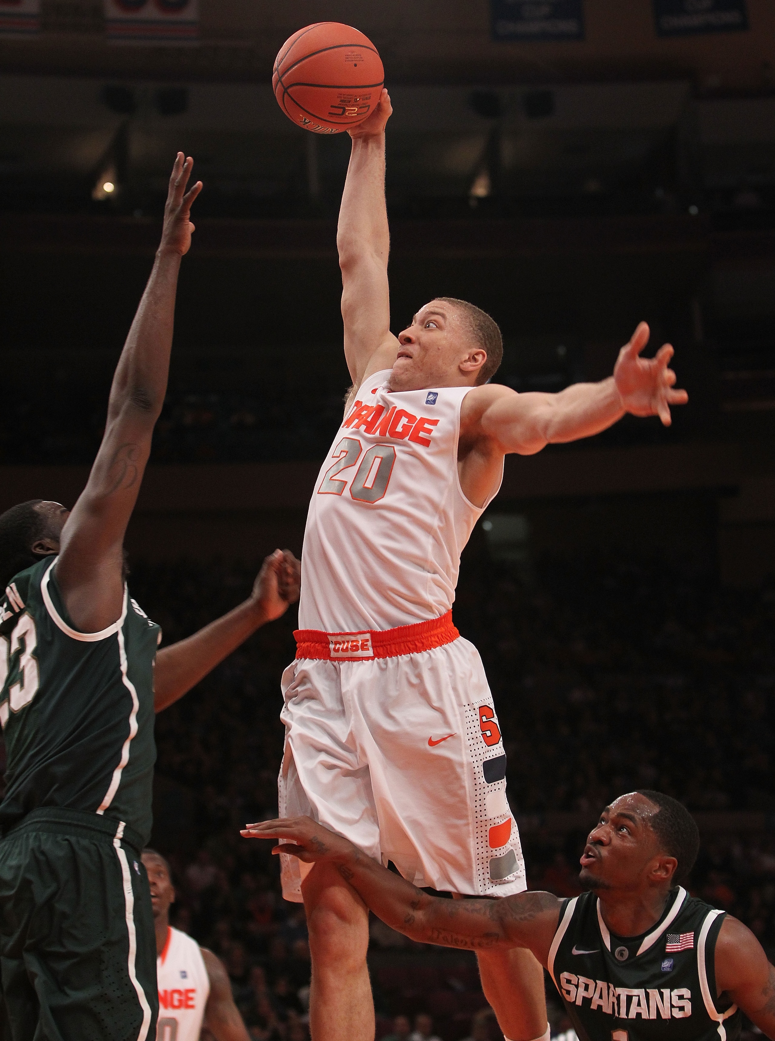 NEW YORK, NY - DECEMBER 07:  Brandon Triche #30 of Syracuse Orange goes up for the dunk against the Michigan State Spartans during their game at the Jimmy V Classic at Madison Square Garden on December 7, 2010 in New York City.  (Photo by Nick Laham/Getty