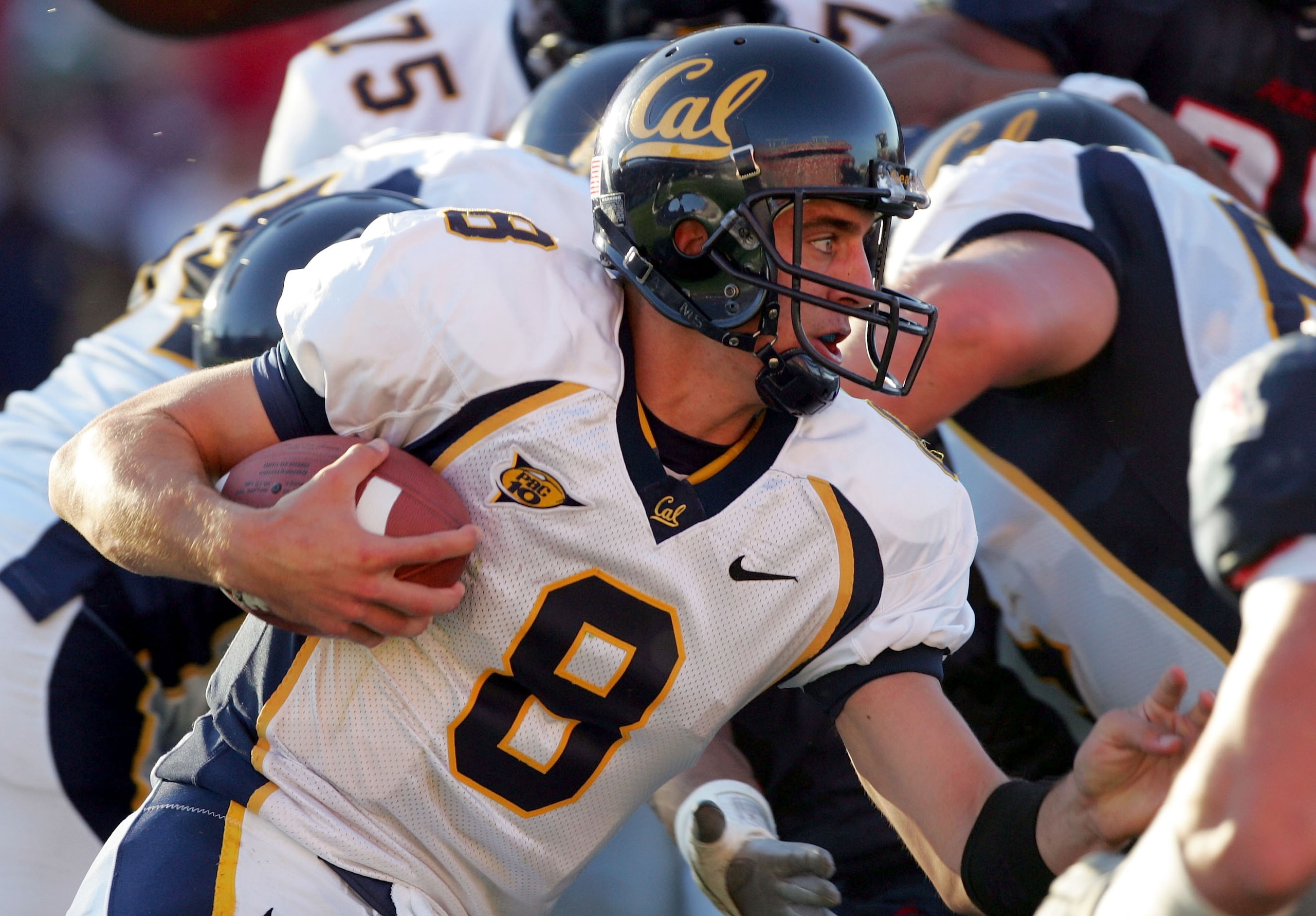 TUCSON, AZ - OCTOBER 23:   Aaron Rodgers #8 of California Golden Bears runs for a  first down on a quarerback sneak against Arizona Wildcats in the first quarter at Arizona Stadium on October 23, 2004 in Tucson, Arizona.  (Photo by Harry How/Getty Images)