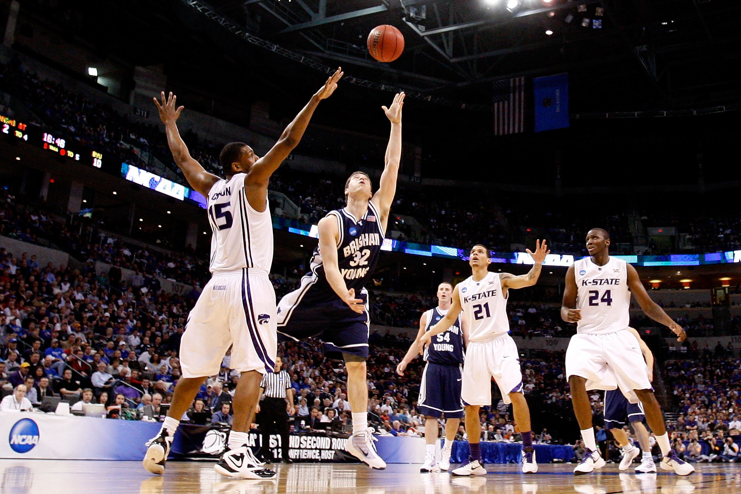 OKLAHOMA CITY - MARCH 20:  Jimmer Fredette #32 of the Brigham Young Cougars drives for a shot attempt against Luis Colon #15 of the Kansas State Wildcats during the second round of the 2010 NCAA men's basketball tournament at Ford Center on March 20, 2010