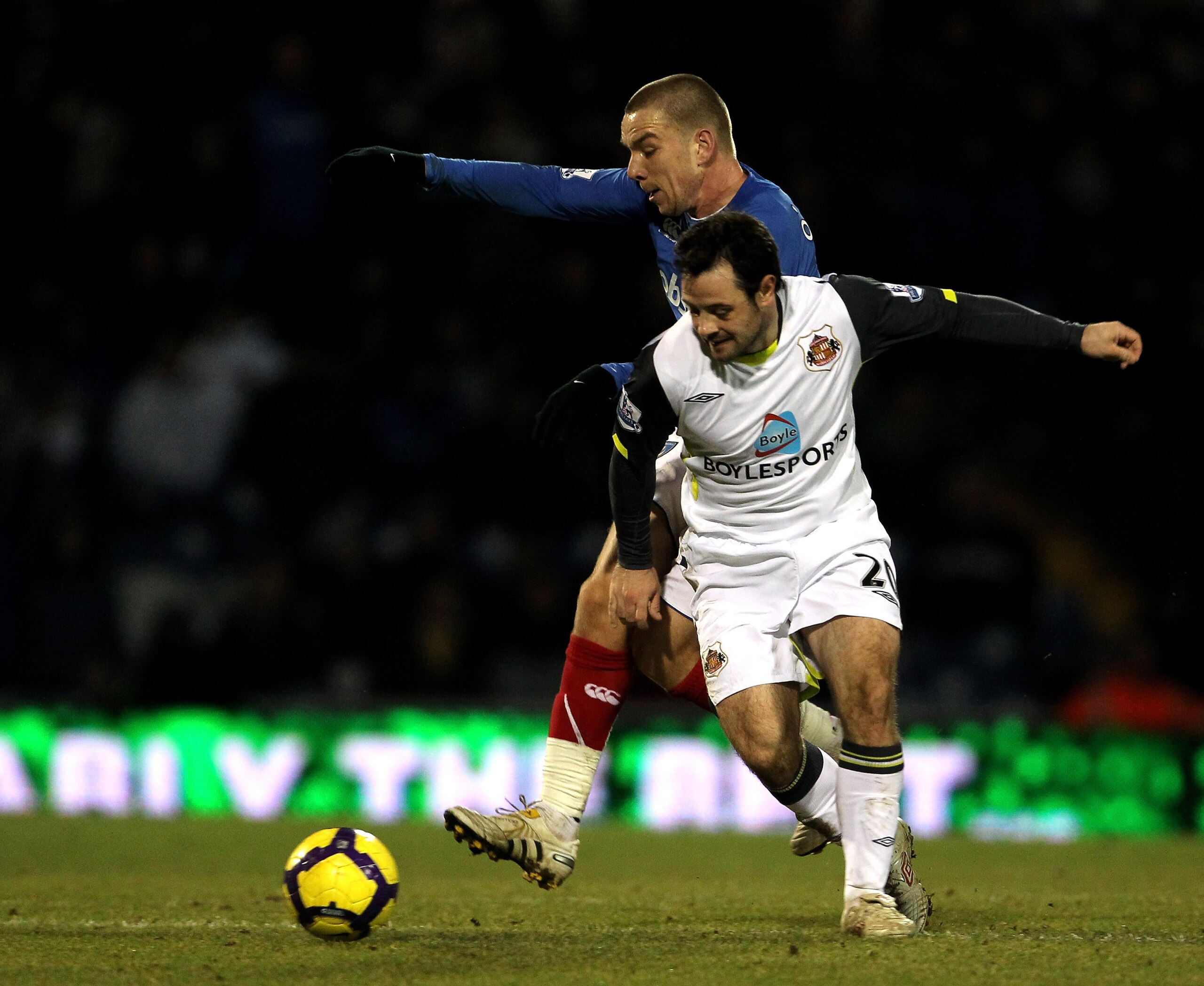 PORTSMOUTH, ENGLAND - FEBRUARY 09: Jamie O'Hara of Portsmouth gets tackled by Andy Reid of Sunderland during the Barclays Premier League match between Portsmouth and Sunderland at Fratton Park on February 9, 2010 in Portsmouth, England.  (Photo by Phil Co