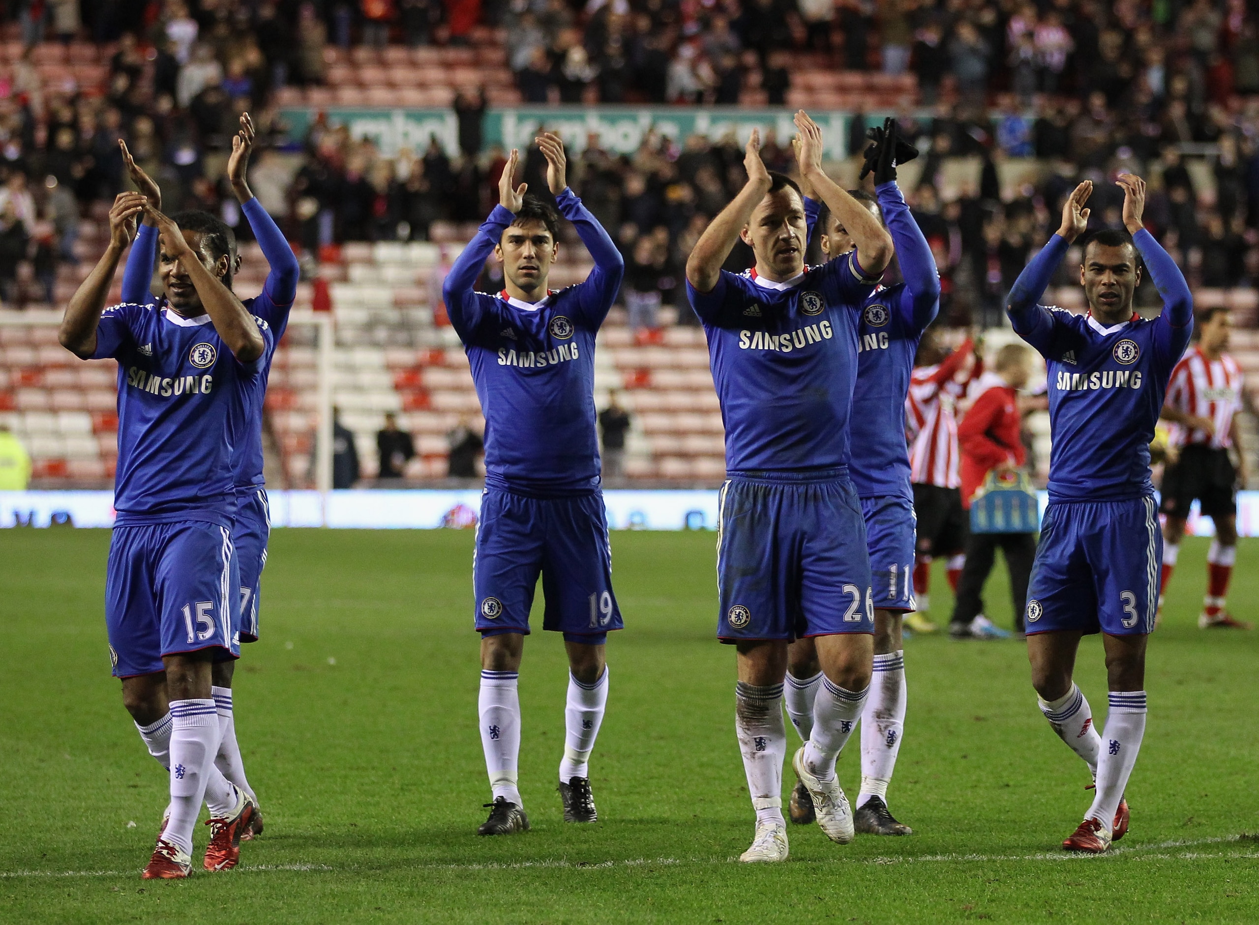 SUNDERLAND, ENGLAND - FEBRUARY 01: John Terry of Chelsea (second right) with his team mates celebrate victory after the Barclays Premier League match between Sunderland and Chelsea at the Stadium of Light on February 1, 2011 in Sunderland, England. (Pho SUNDERLAND, ENGLAND - FEBRUARY 01: John Terry of Chelsea (second right) with his team mates celebrate victory after the Barclays Premier League match between Sunderland and Chelsea at the Stadium of Light on February 1, 2011 in Sunderland, England. (Pho