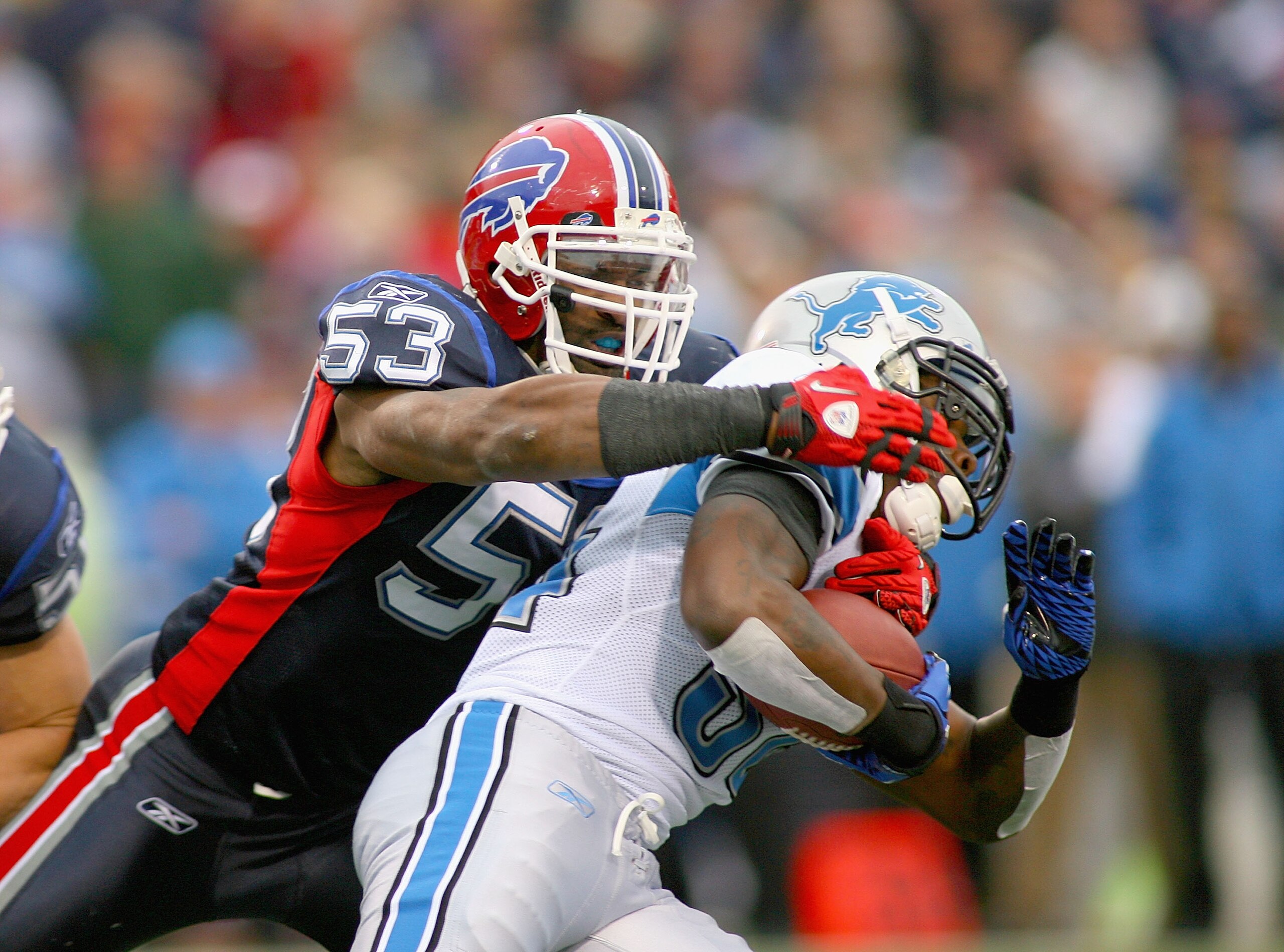 ORCHARD PARK, NY - NOVEMBER 14: Reggie Torbor #50 of the Buffalo Bills tackles Kevin Smith #34 of the Detroit Lions at Ralph Wilson Stadium on November 14, 2010 in Orchard Park, New York.  (Photo by Rick Stewart/Getty Images)