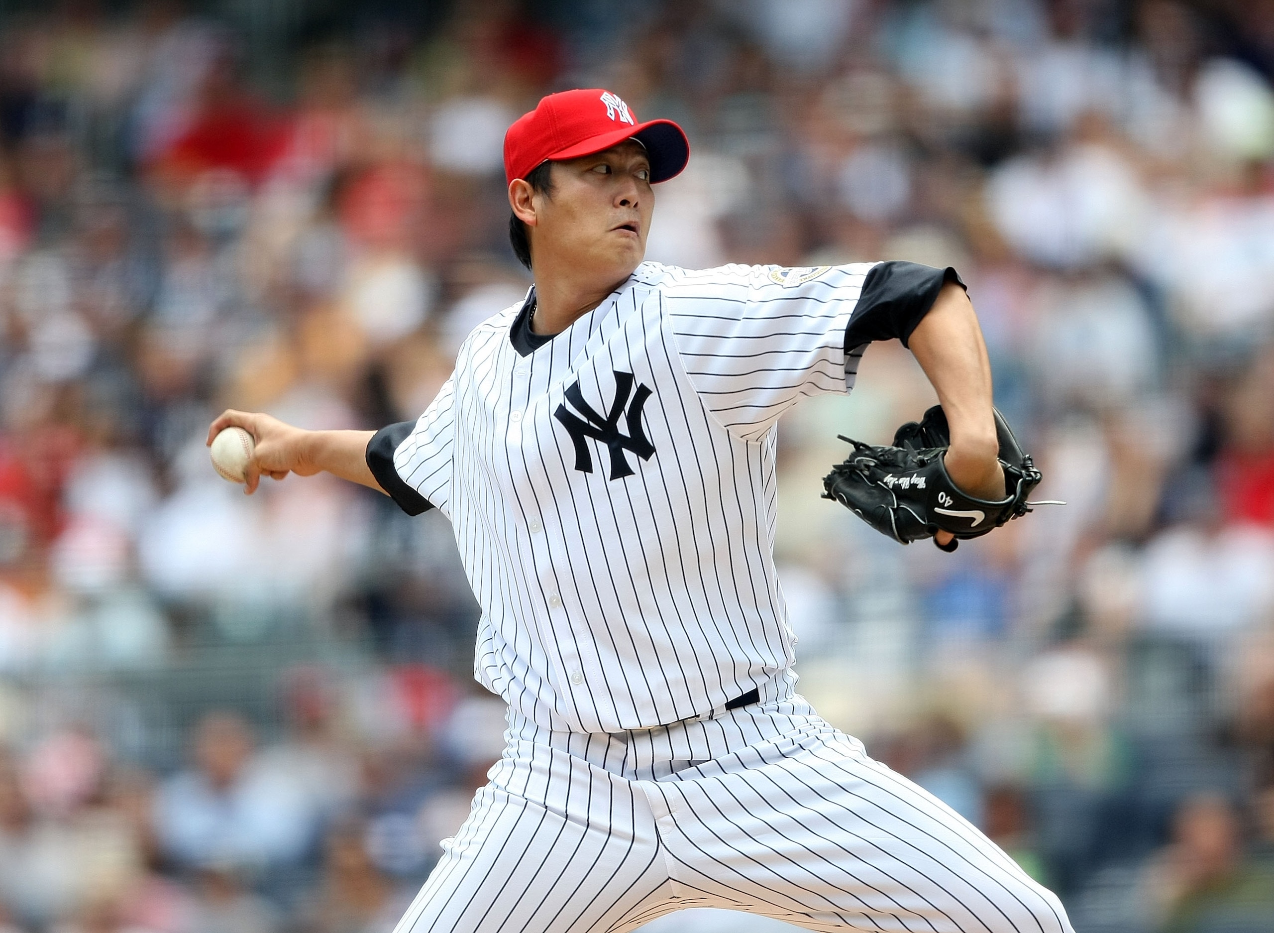 NEW YORK - JULY 04: Chien-Ming Wang #40 of the New York Yankees pitches against the Toronto Blue Jays on July 4, 2009 at Yankee Stadium in the Bronx borough of New York City. (Photo by Nick Laham/Getty Images) NEW YORK - JULY 04: Chien-Ming Wang #40 of the New York Yankees pitches against the Toronto Blue Jays on July 4, 2009 at Yankee Stadium in the Bronx borough of New York City. (Photo by Nick Laham/Getty Images)