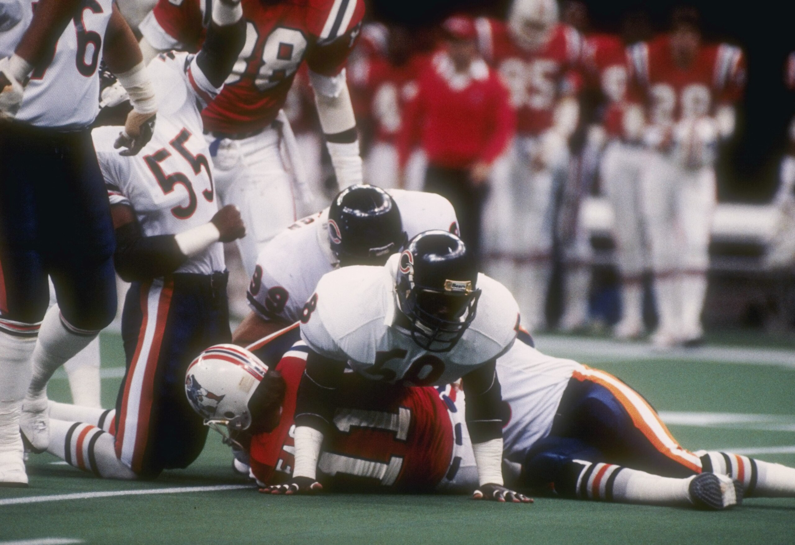 26  Jan 1986:  Quarterback Tony Eason #11 of the New England Patriots is brought down by linebacker Wilber Marshall #58 of the Chicago Bears during Super Bowl XX  game at the Louisiana Superdome in New Orleans, Louisiana.  The Bears won the game 46-10.