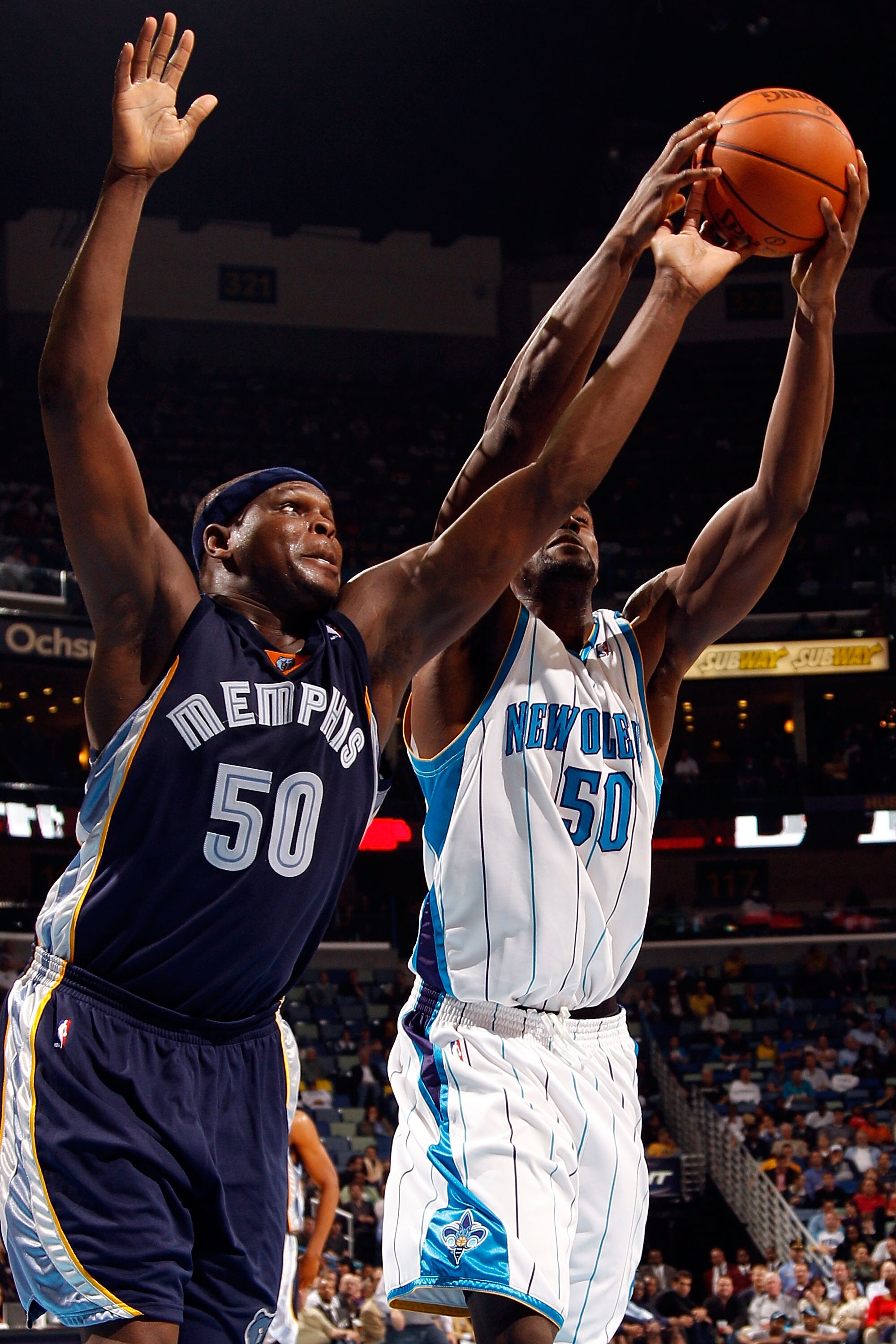 NEW ORLEANS - JANUARY 20:  Zach Randolph #50 of the Memphis Grizzlies battles for a rebound with Emeka Okafor #50 of the New Orleans Hornets at the New Orleans Arena on January 20, 2010 in New Orleans, Louisiana.  The Hornets defeated the Grizzlies 113-11