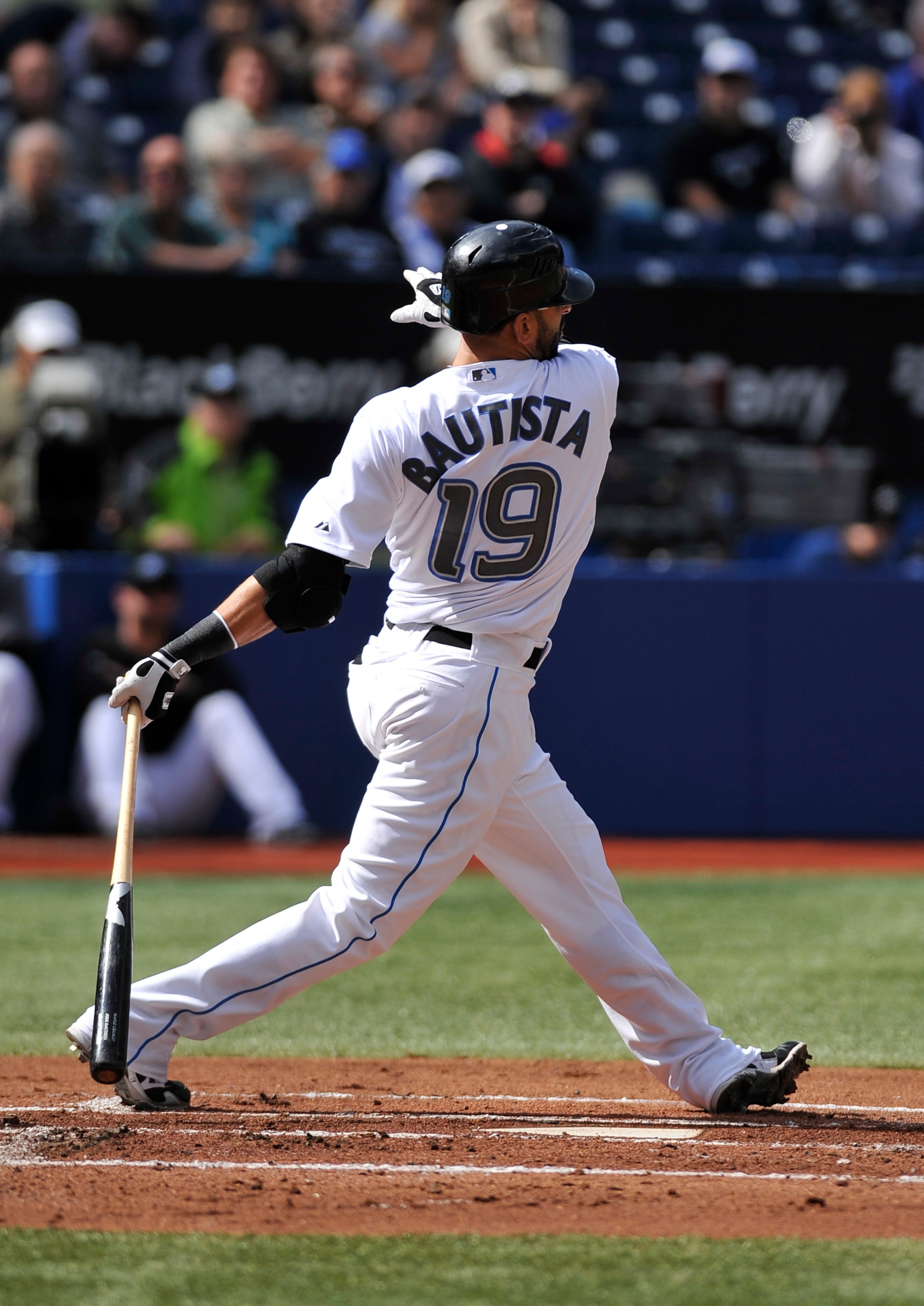 TORONTO - SEPTEMBER 23:  Jose Bautista #19 of the Toronto Blue Jays watches as his 50th home run of the season leaves the ball park during game action against the Seattle Mariners on September 23, 2010 at Rogers Centre in Toronto, Ontario, Canada. (Photo