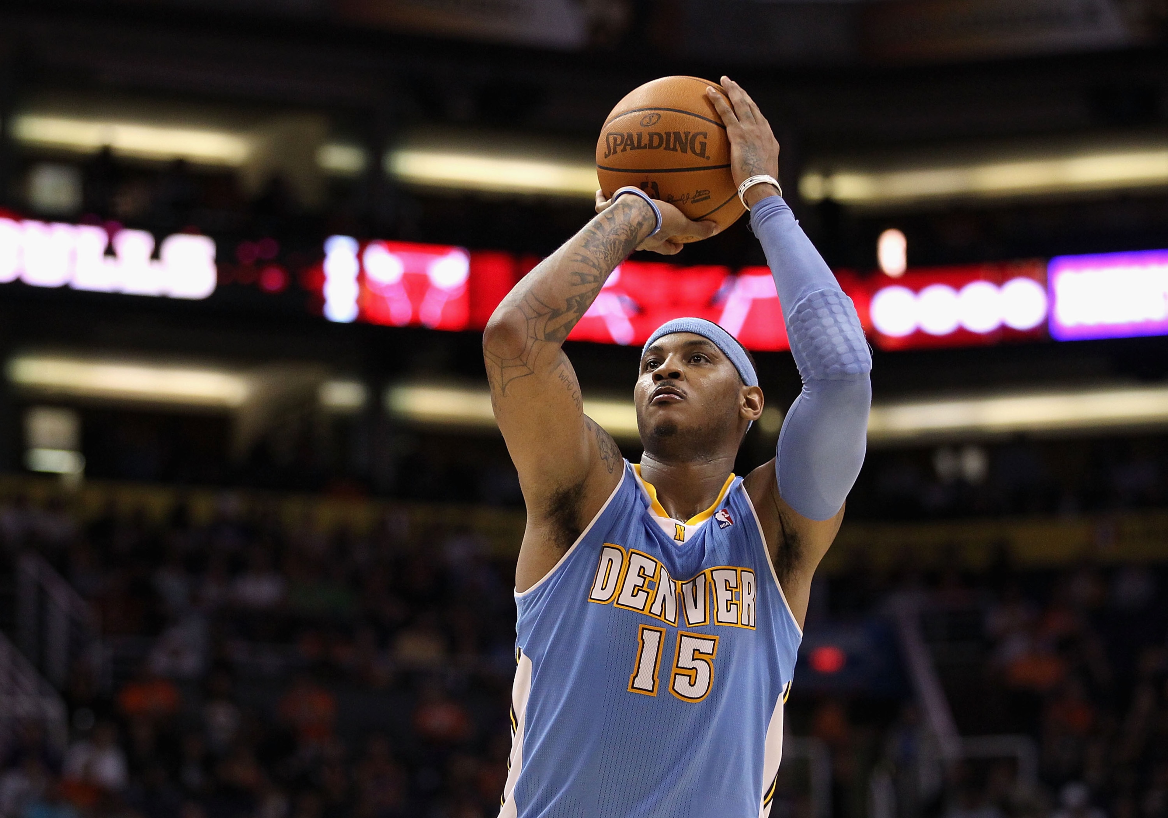 PHOENIX - NOVEMBER 15:  Carmelo Anthony #15 of the Denver Nuggets shoots a free throw shot during the NBA game against the Phoenix Suns at US Airways Center on November 15, 2010 in Phoenix, Arizona.  The Suns defeated the Nuggets 100-94.  NOTE TO USER: Us