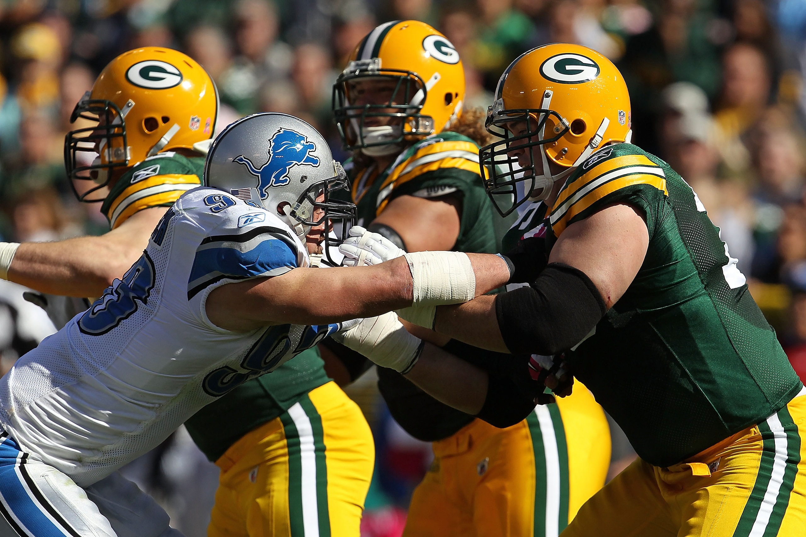 GREEN BAY, WI - OCTOBER 03: Chad Clifton #76 of the Green Bay Packers blocks Kyle Vanden Bosch #93 of the Detroit Lions at Lambeau Field on October 3, 2010 in Green Bay, Wisconsin. The Packers defeated the Lions 28-26. (Photo by Jonathan Daniel/Getty Imag GREEN BAY, WI - OCTOBER 03: Chad Clifton #76 of the Green Bay Packers blocks Kyle Vanden Bosch #93 of the Detroit Lions at Lambeau Field on October 3, 2010 in Green Bay, Wisconsin. The Packers defeated the Lions 28-26. (Photo by Jonathan Daniel/Getty Imag