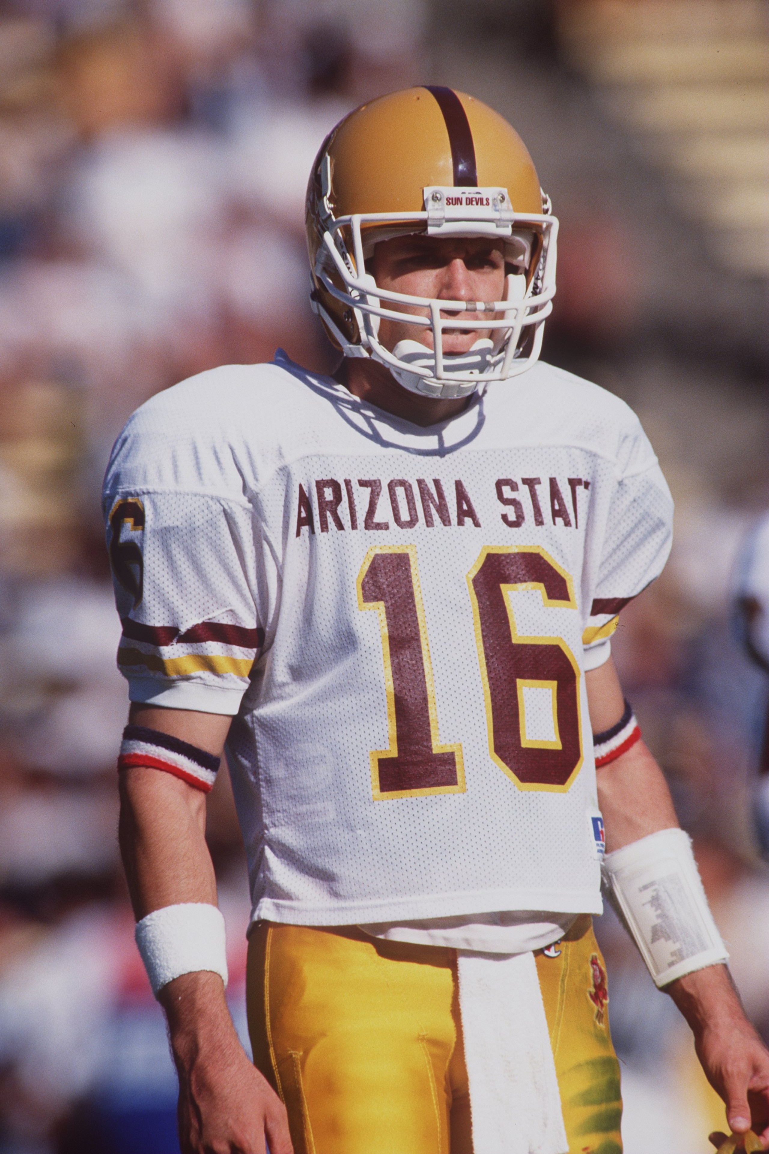 11 Nov 1995:  Quarterback Jake Plummer of the Arizona State Sun Devils looks to the sideline to receive the offensive play call during an huddle in between plays in the Sun Devils 38-29 victory over the Cal Golden Bears at Memorial Stadium in Berkley, Cal