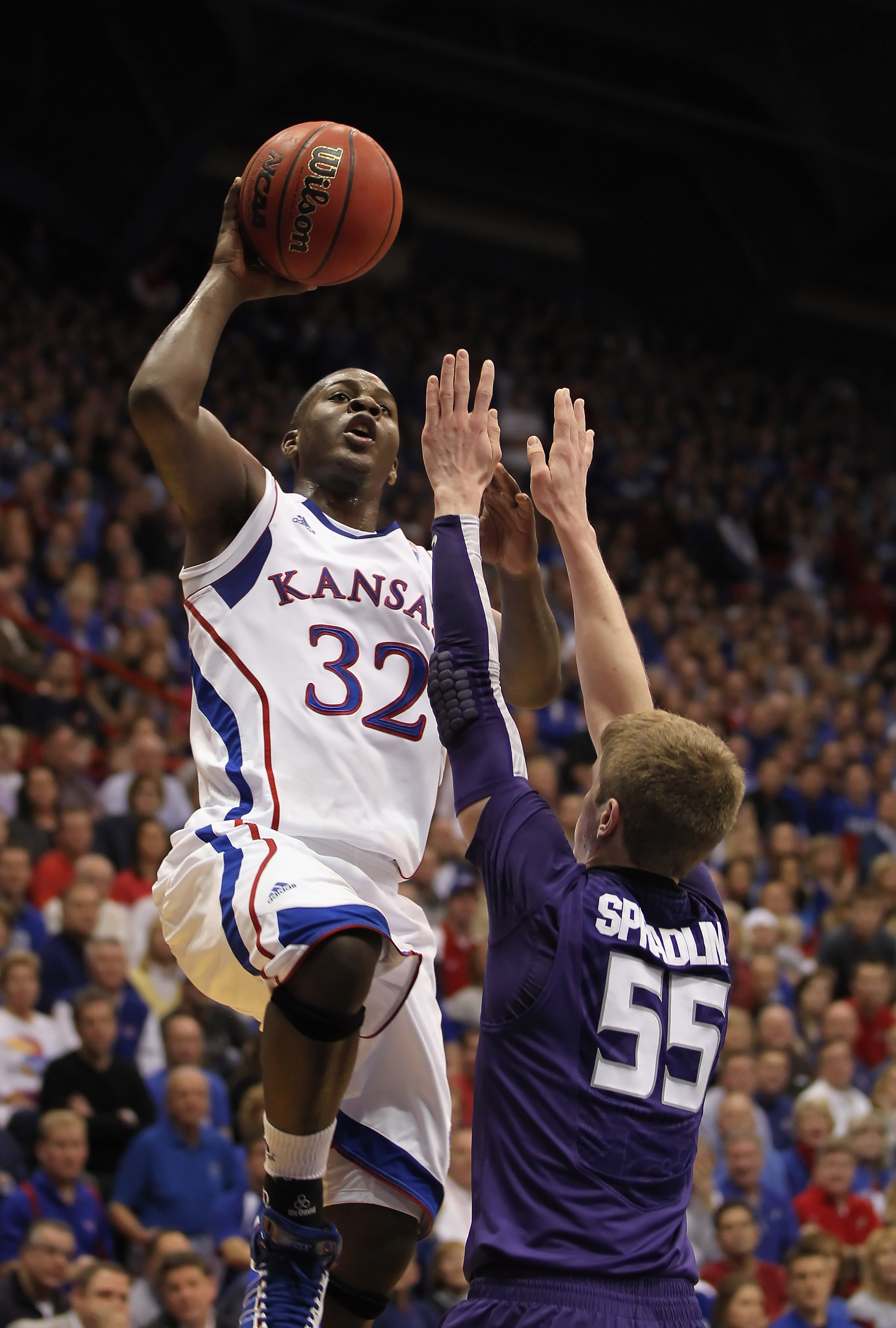 LAWRENCE, KS - JANUARY 29:  Josh Selby #32 of the Kansas Jayhawks shoots over Will Spradling #55 of the Kansas State Wildcats for a rebound during the game on January 29, 2011 at Allen Fieldhouse in Lawrence, Kansas.  (Photo by Jamie Squire/Getty Images)