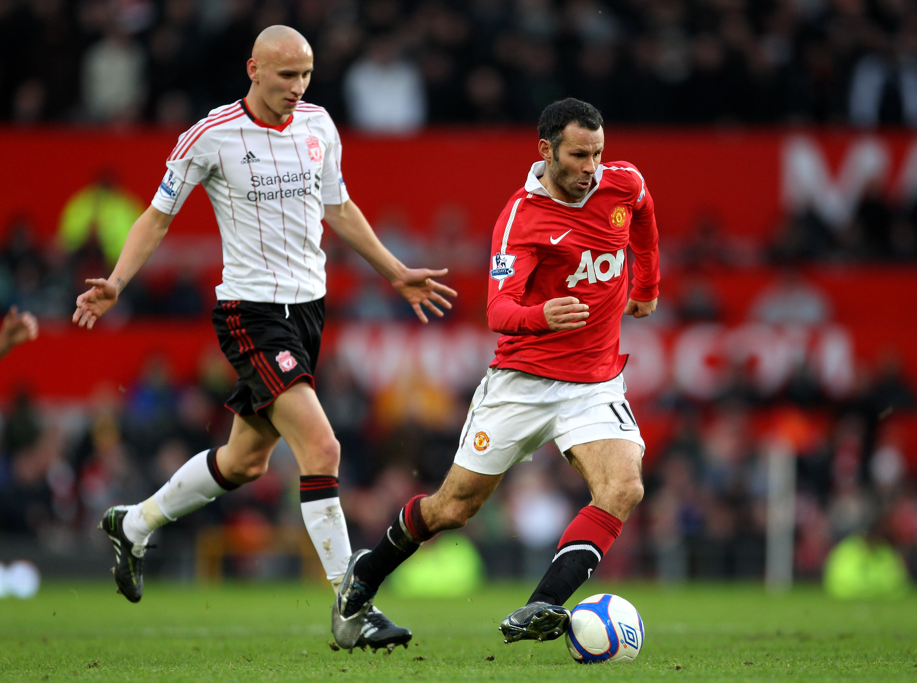 MANCHESTER, ENGLAND - JANUARY 09:  Ryan Giggs of Manchester United goes past Jonjo Shelvey of Liverpool during the FA Cup sponsored by E.ON 3rd round match between Manchester United and Liverpool at Old Trafford on January 9, 2011 in Manchester, England.