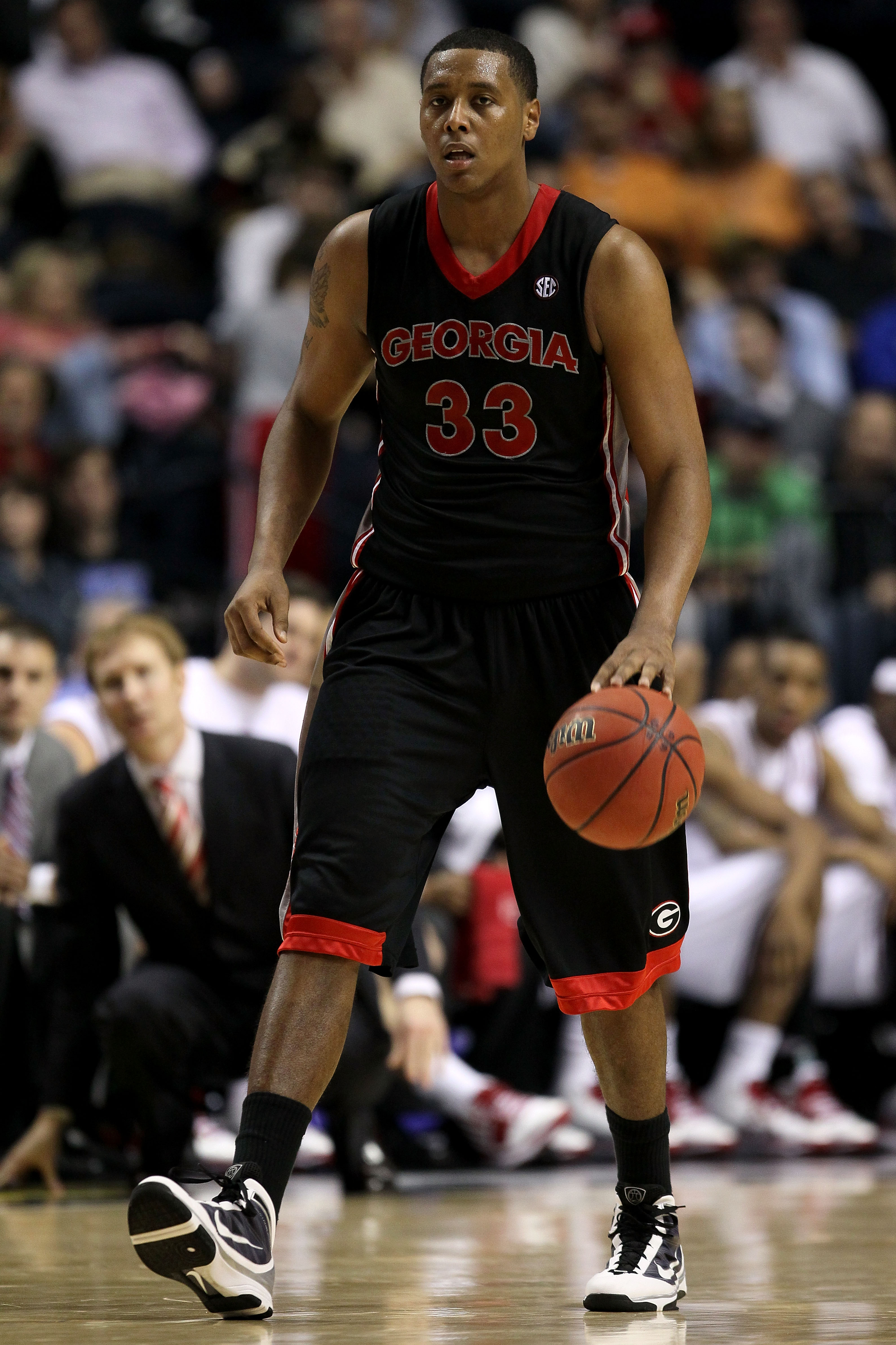NASHVILLE, TN - MARCH 11:  Trey Thompkins #33 of the Georgia Bulldogs brings the ball up against the Arkanasas Razorbacks during the first round of the SEC Men's Basketball Tournament at the Bridgestone Arena on March 11, 2010 in Nashville, Tennessee.  (P
