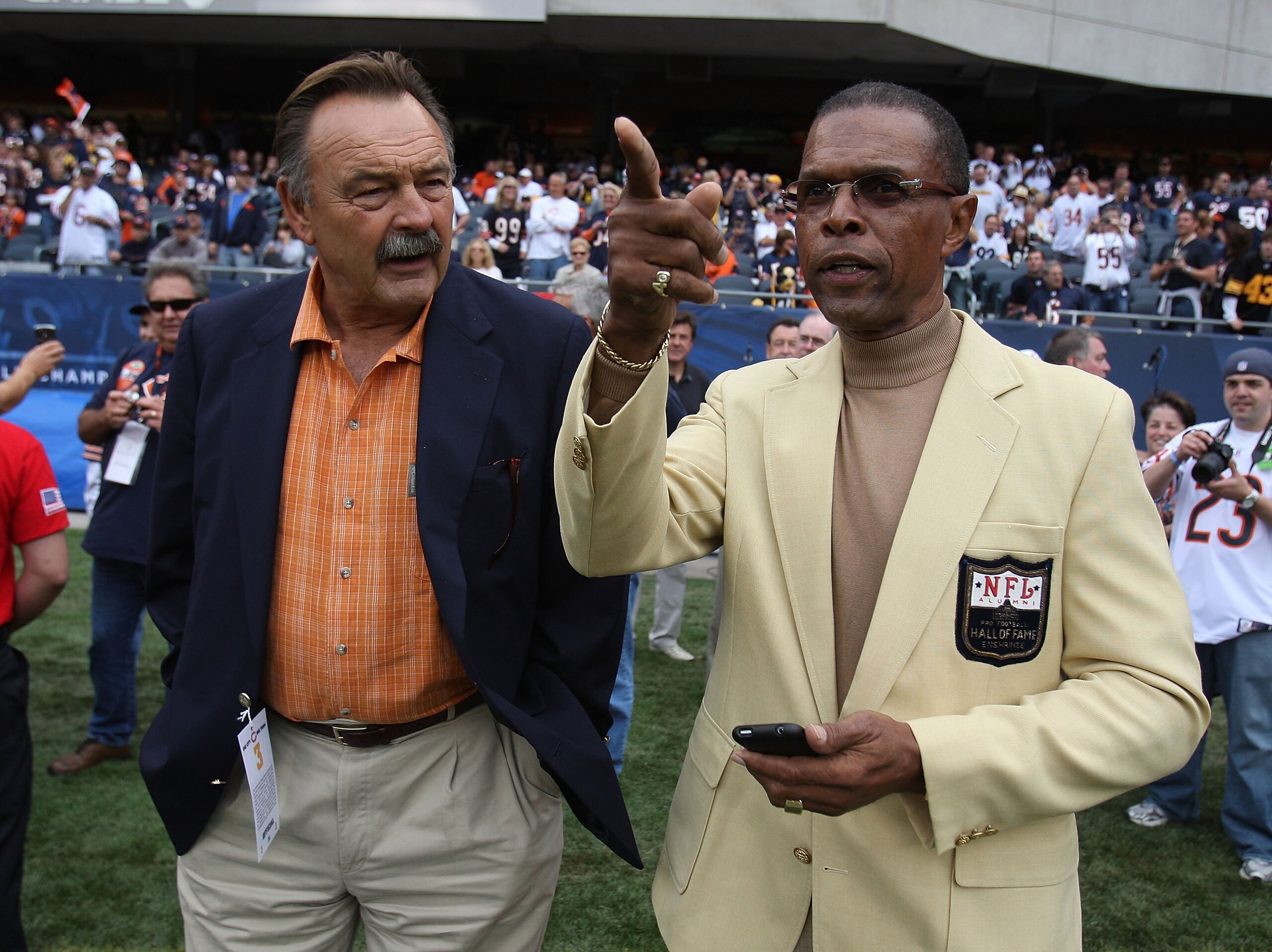 CHICAGO - SEPTEMBER 20: Hall of Fame Chicago Bears Dick Butkus (L) and Gale Sayers chat on the sidelines before a game between the Bears and the Pittsburgh Steelers on September 20, 2009 at Soldier Field in Chicago, Illinois. The Bears defeated the Steele