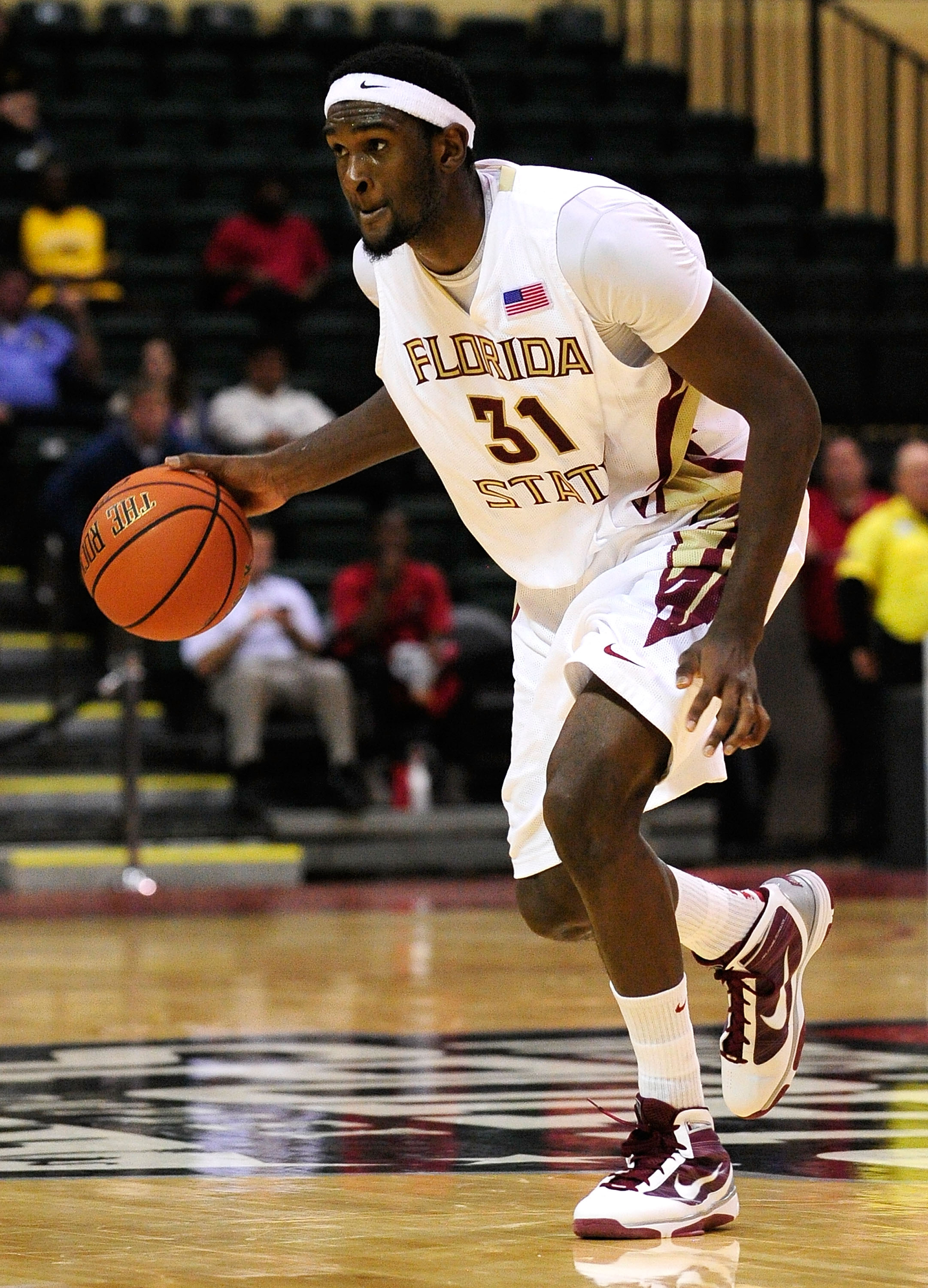 ORLANDO, FL - NOVEMBER 27:  Chris Singleton #31 of the Florida State Seminoles looks to pass against the Alabama Crimson Tide during the Old Spice Classic at Disney's Milk House on November 27, 2009 in Orlando, Florida.  (Photo by Sam Greenwood/Getty Imag