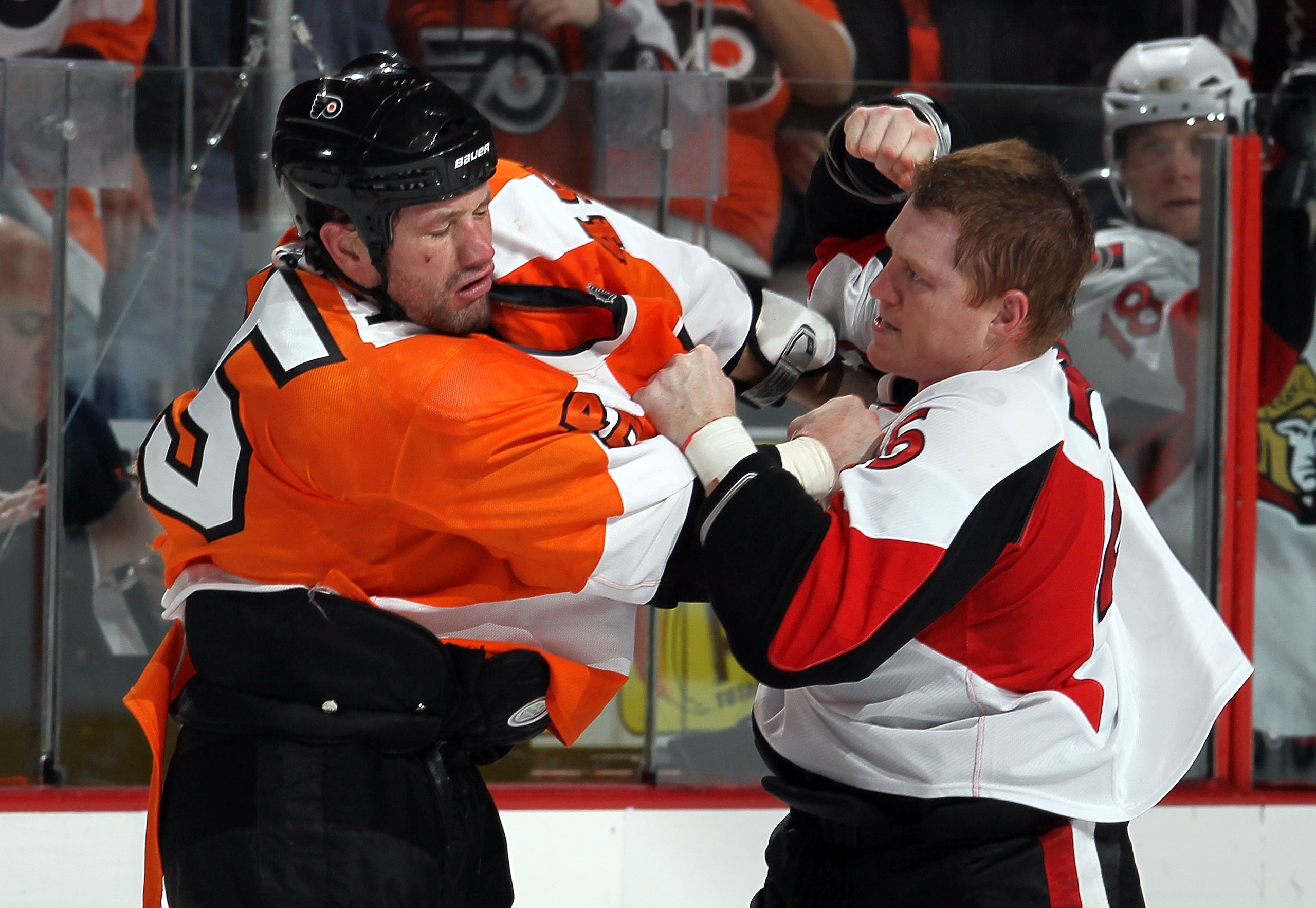 PHILADELPHIA, PA - JANUARY 20: Chris Neil #25 of the Ottawa Senators trades punches with Jody Shelley #45 of the Philadelphia Flyers during the third period on January 20, 2011 at Wells Fargo Center in Philadelphia, Pennsylvania. The Flyers defeated the PHILADELPHIA, PA - JANUARY 20: Chris Neil #25 of the Ottawa Senators trades punches with Jody Shelley #45 of the Philadelphia Flyers during the third period on January 20, 2011 at Wells Fargo Center in Philadelphia, Pennsylvania. The Flyers defeated the