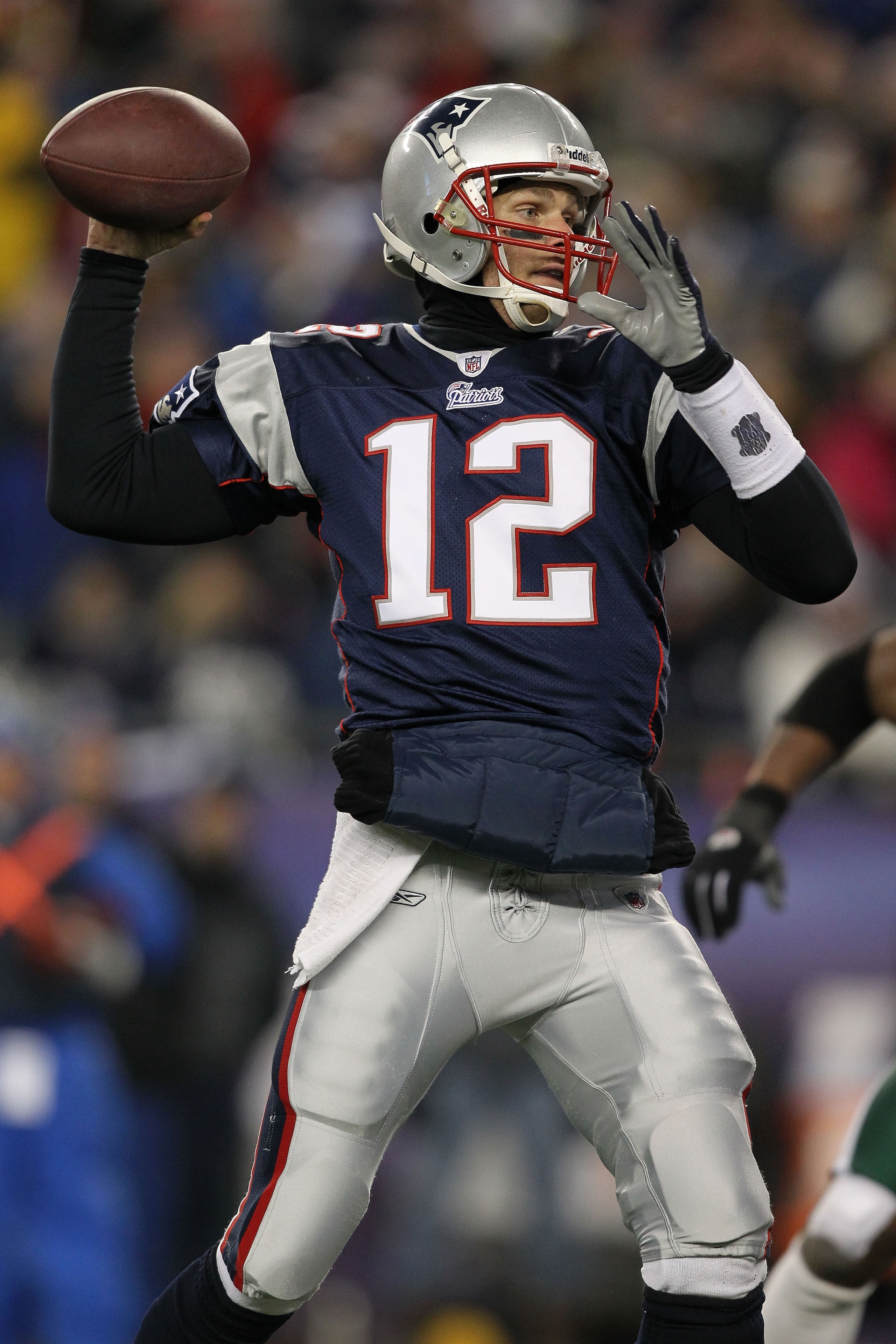 FOXBORO, MA - JANUARY 16:  Quarterback Tom Brady #12 of the New England Patriots throws a pass during their 2011 AFC divisional playoff game against the New York Jets at Gillette Stadium on January 16, 2011 in Foxboro, Massachusetts.  (Photo by Al Bello/G