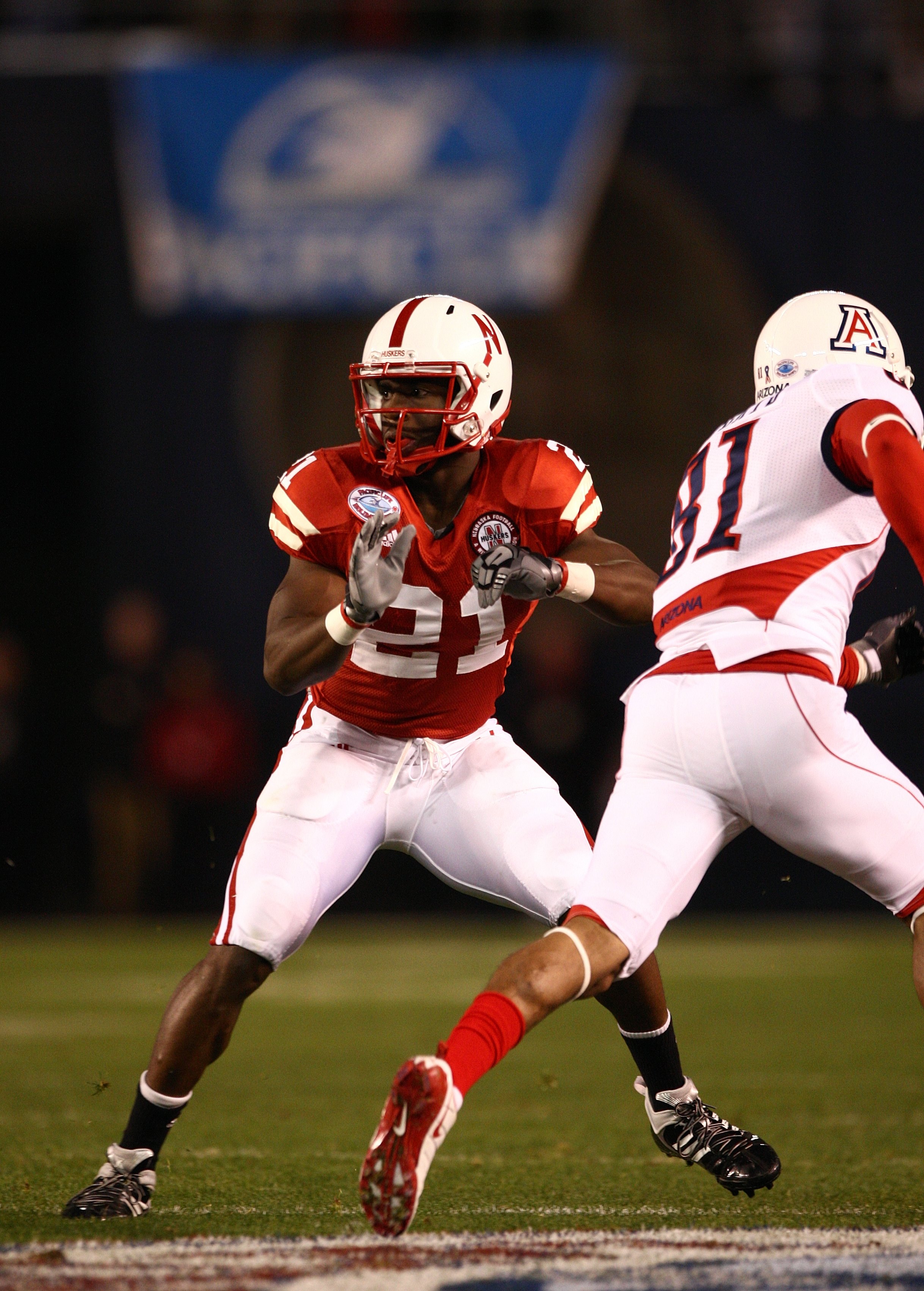 SAN DIEGO - DECEMBER 30:  Prince Amukamara #21 of the University of Nebraska Cornhuskers defends the play during the Pacific Life Holiday Bowl against University of Arizona Wildcats on December 30, 2009 at Qualcomm Stadium in San Diego, California. The Co