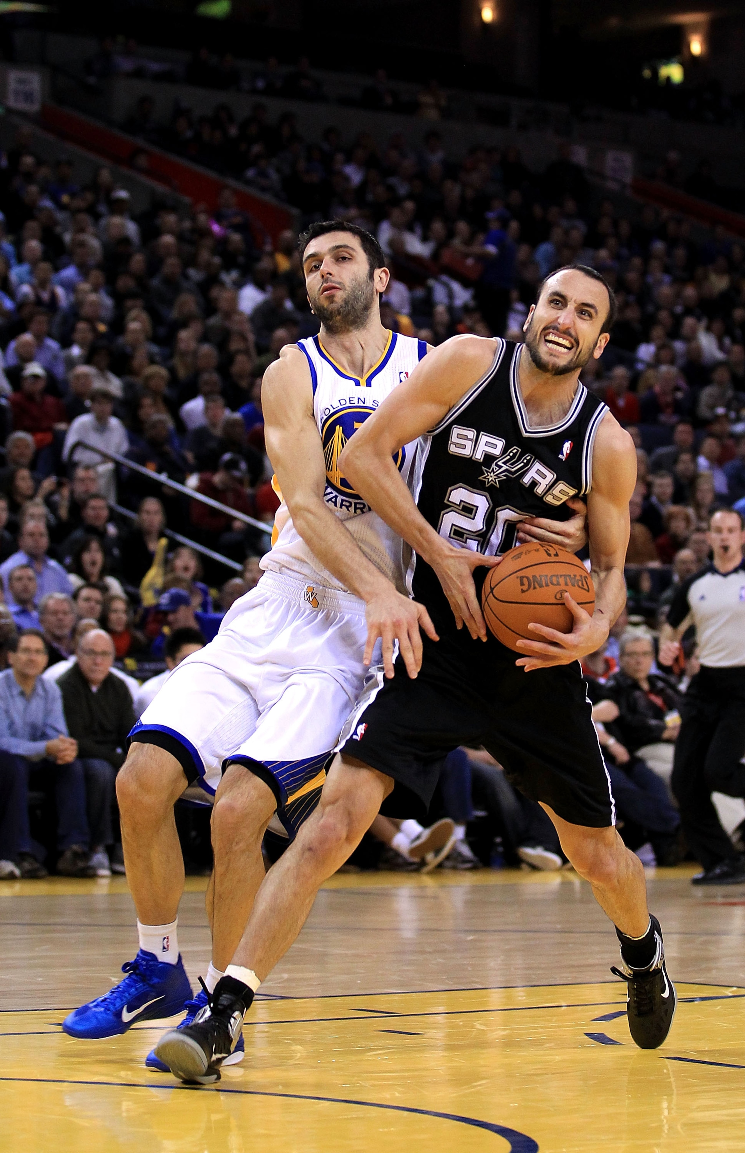 OAKLAND, CA - JANUARY 24: Manu Ginobili #20 of the San Antonio Spurs in action against the Golden State Warriors at Oracle Arena on January 24, 2011 in Oakland, California. NOTE TO USER: User expressly acknowledges and agrees that, by downloading and or OAKLAND, CA - JANUARY 24: Manu Ginobili #20 of the San Antonio Spurs in action against the Golden State Warriors at Oracle Arena on January 24, 2011 in Oakland, California. NOTE TO USER: User expressly acknowledges and agrees that, by downloading and or