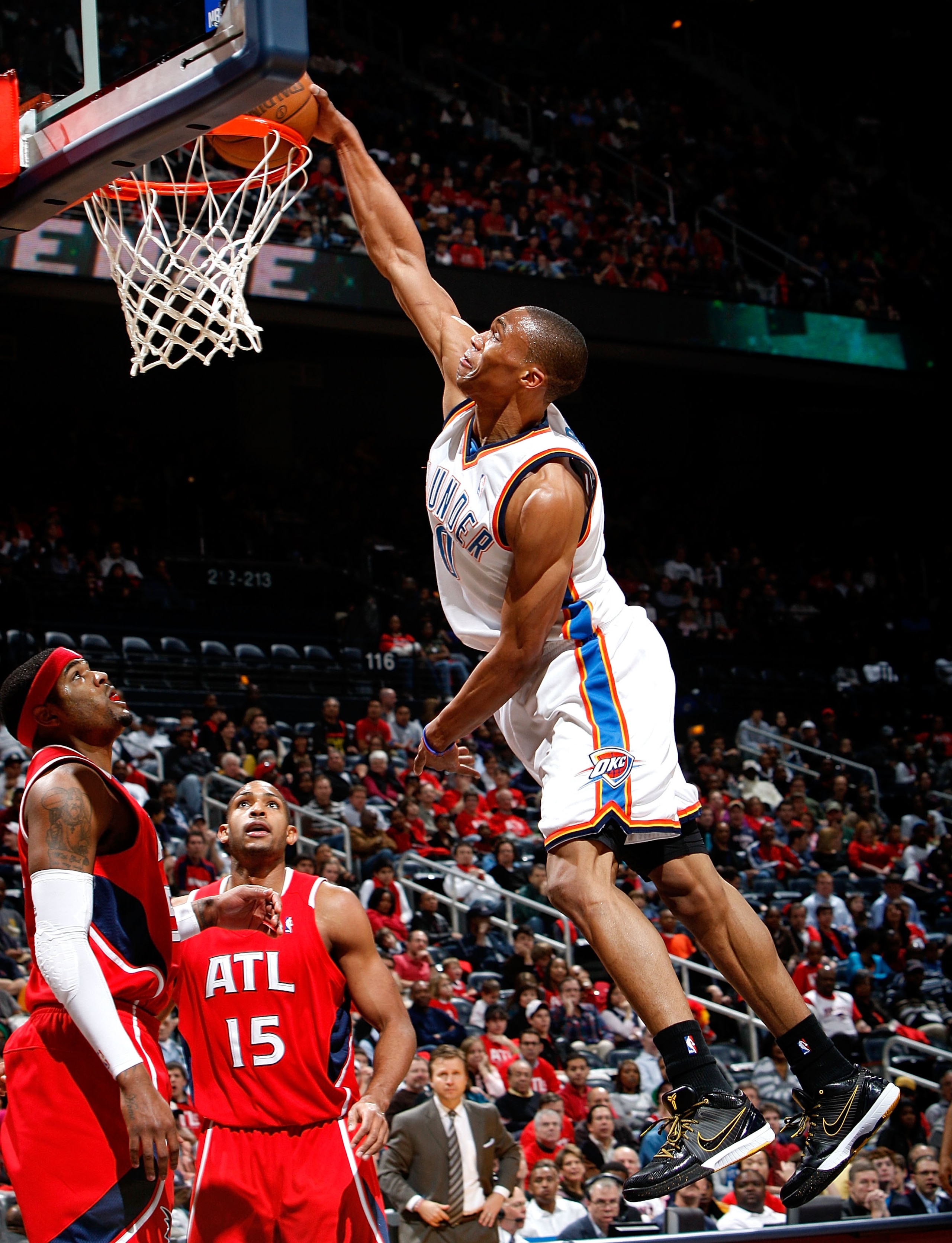 ATLANTA - JANUARY 18: Russell Westbrook #0 of the Oklahoma City Thunder dunks against Josh Smith #5 and Al Horford #15 of the Atlanta Hawks at Philips Arena on January 18, 2010 in Atlanta, Georgia. NOTE TO USER: User expressly acknowledges and agrees th ATLANTA - JANUARY 18: Russell Westbrook #0 of the Oklahoma City Thunder dunks against Josh Smith #5 and Al Horford #15 of the Atlanta Hawks at Philips Arena on January 18, 2010 in Atlanta, Georgia. NOTE TO USER: User expressly acknowledges and agrees th