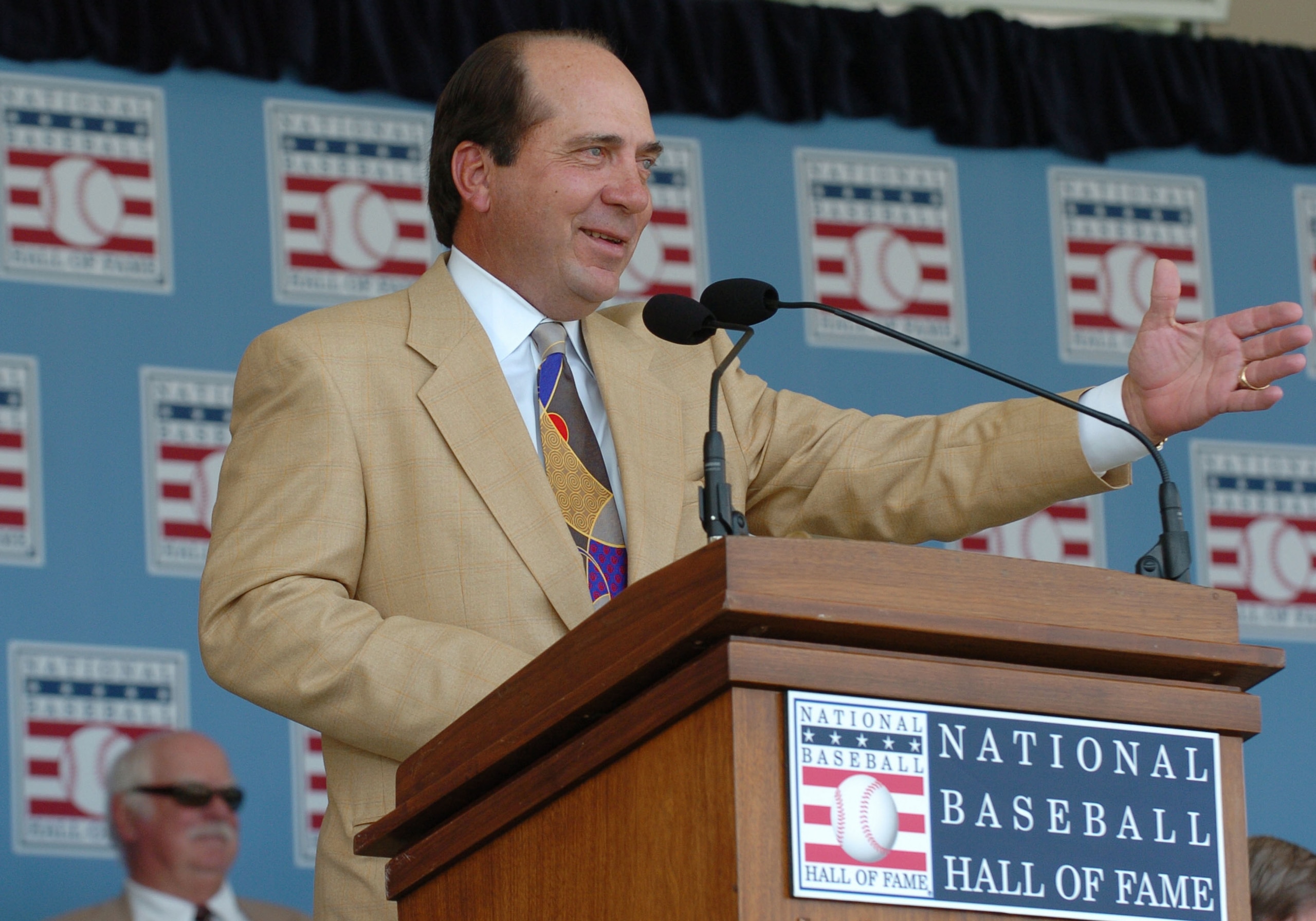 Johnny Bench sings at  2004  Baseball Hall of Fame induction ceremonies  July 25, 2004 in Cooperstown, New York. (Photo by A. Messerschmidt/Getty Images)