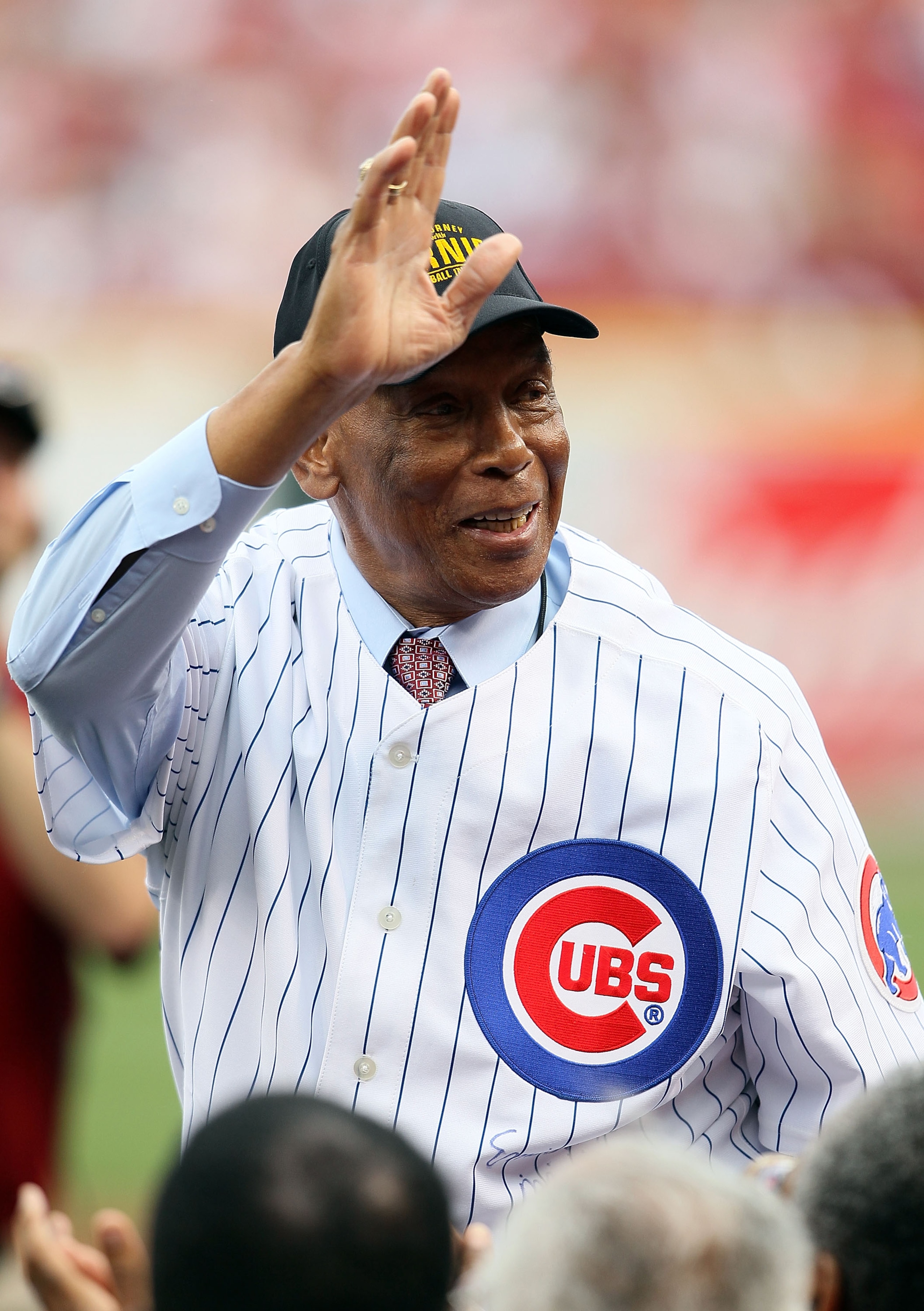 CINCINNATI - MAY 15:  Ernie Banks waves to the crowd before throwing out the first pitch before the Gillette Civil Rights Game between the Cincinnati Reds and the St. Louis Cardinals at Great American Ball Park on May 15, 2010 in Cincinnati, Ohio.  (Photo