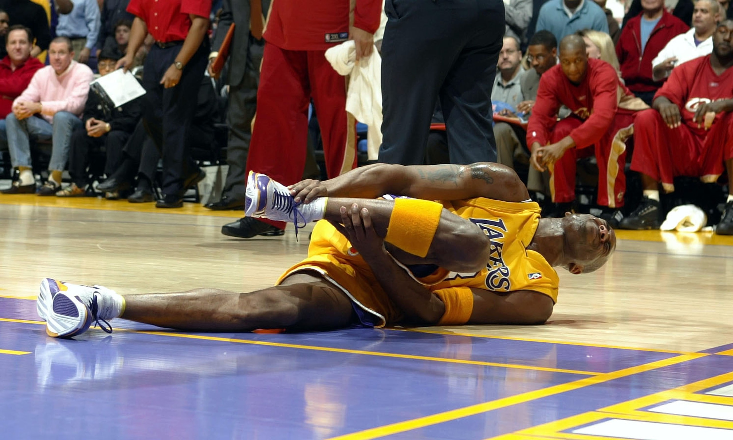 LOS ANGELES - JANUARY 13:  Kobe Bryant #8 of the Los Angeles Lakers grabs his right ankle in pain during NBA action against the Cleveland Cavaliers January 13, 2005 at Staples Center in Los Angeles, California. NOTE TO USER: User expressly acknowledges an