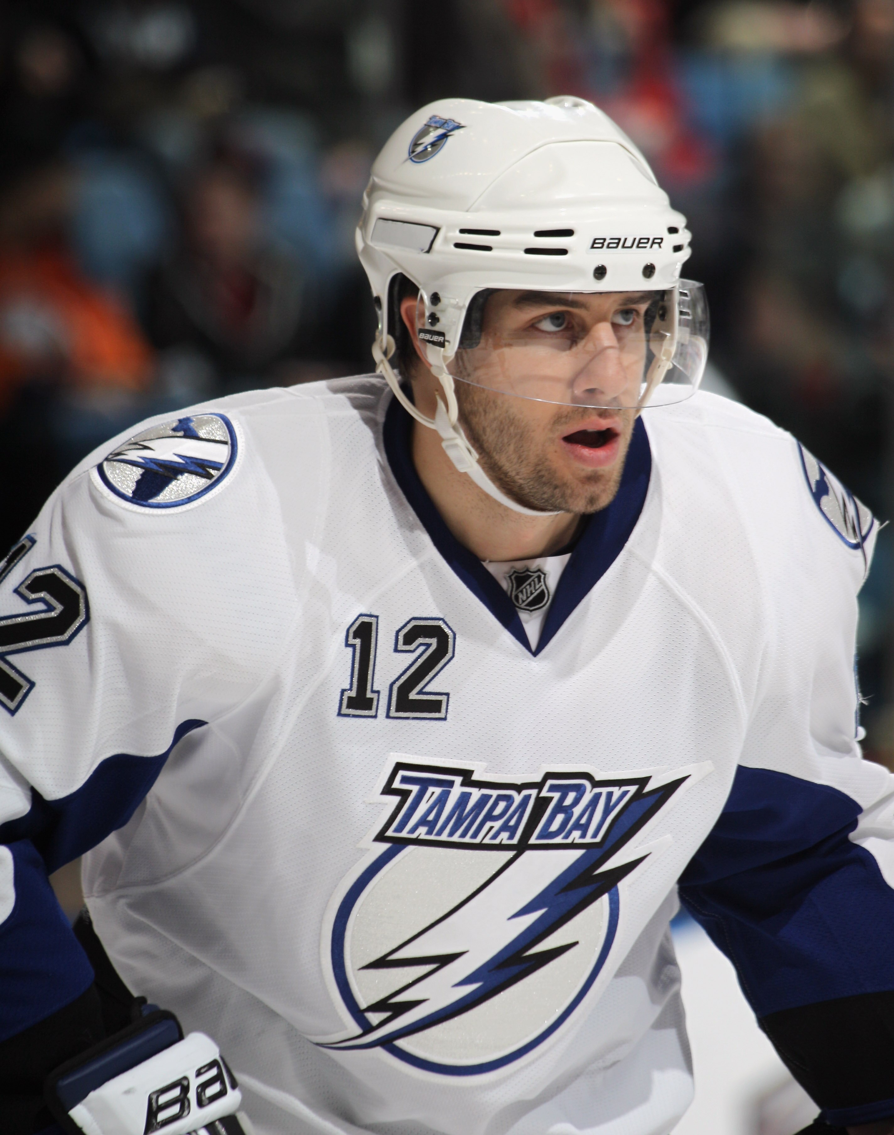UNIONDALE, NY - DECEMBER 22:  Simon Gagne #12 of the Tampa Bay Lightning skates against the New York Islanders at the Nassau Coliseum on December 22, 2010 in Uniondale, New York.  (Photo by Bruce Bennett/Getty Images)