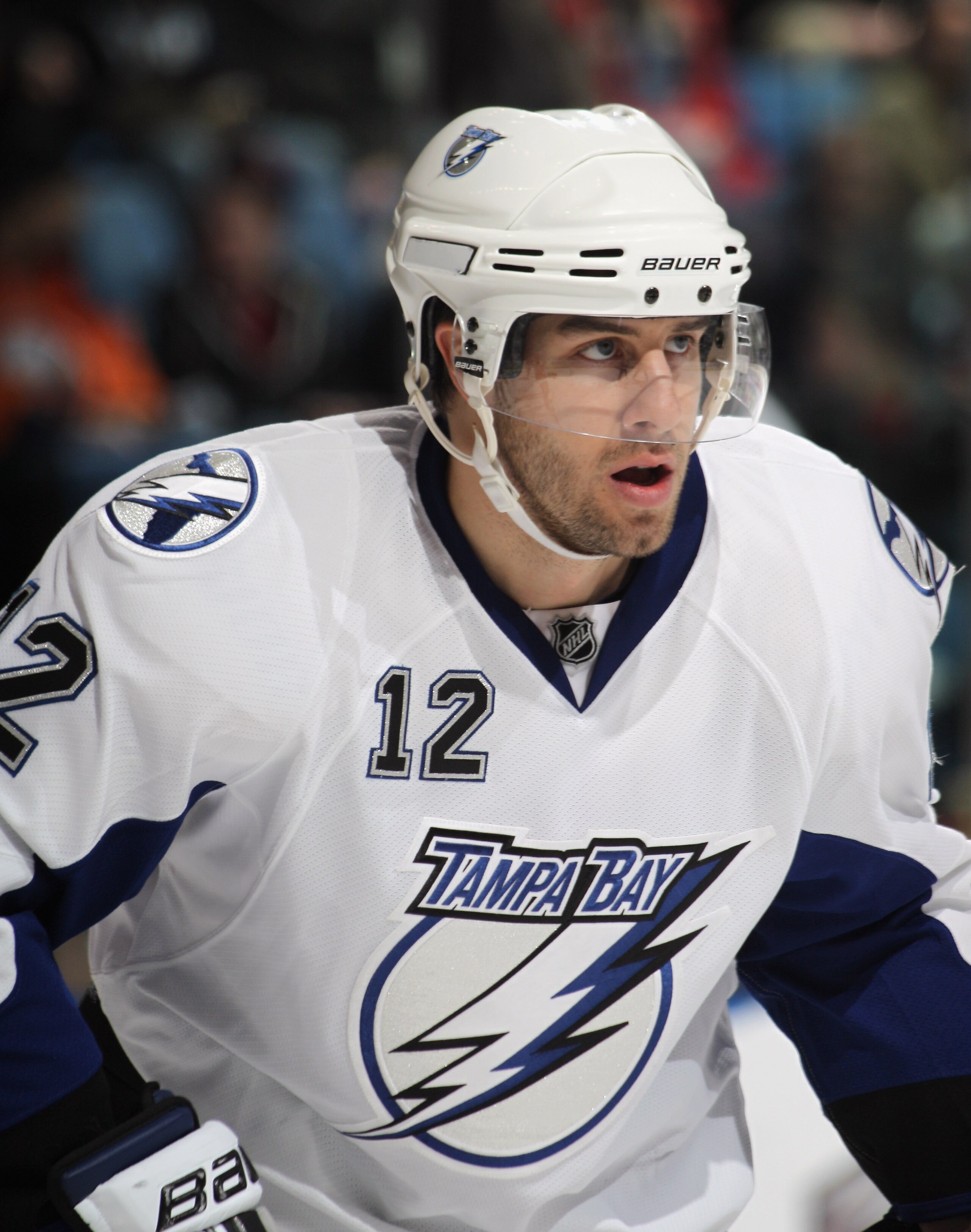 UNIONDALE, NY - DECEMBER 22:  Simon Gagne #12 of the Tampa Bay Lightning skates against the New York Islanders at the Nassau Coliseum on December 22, 2010 in Uniondale, New York.  (Photo by Bruce Bennett/Getty Images)