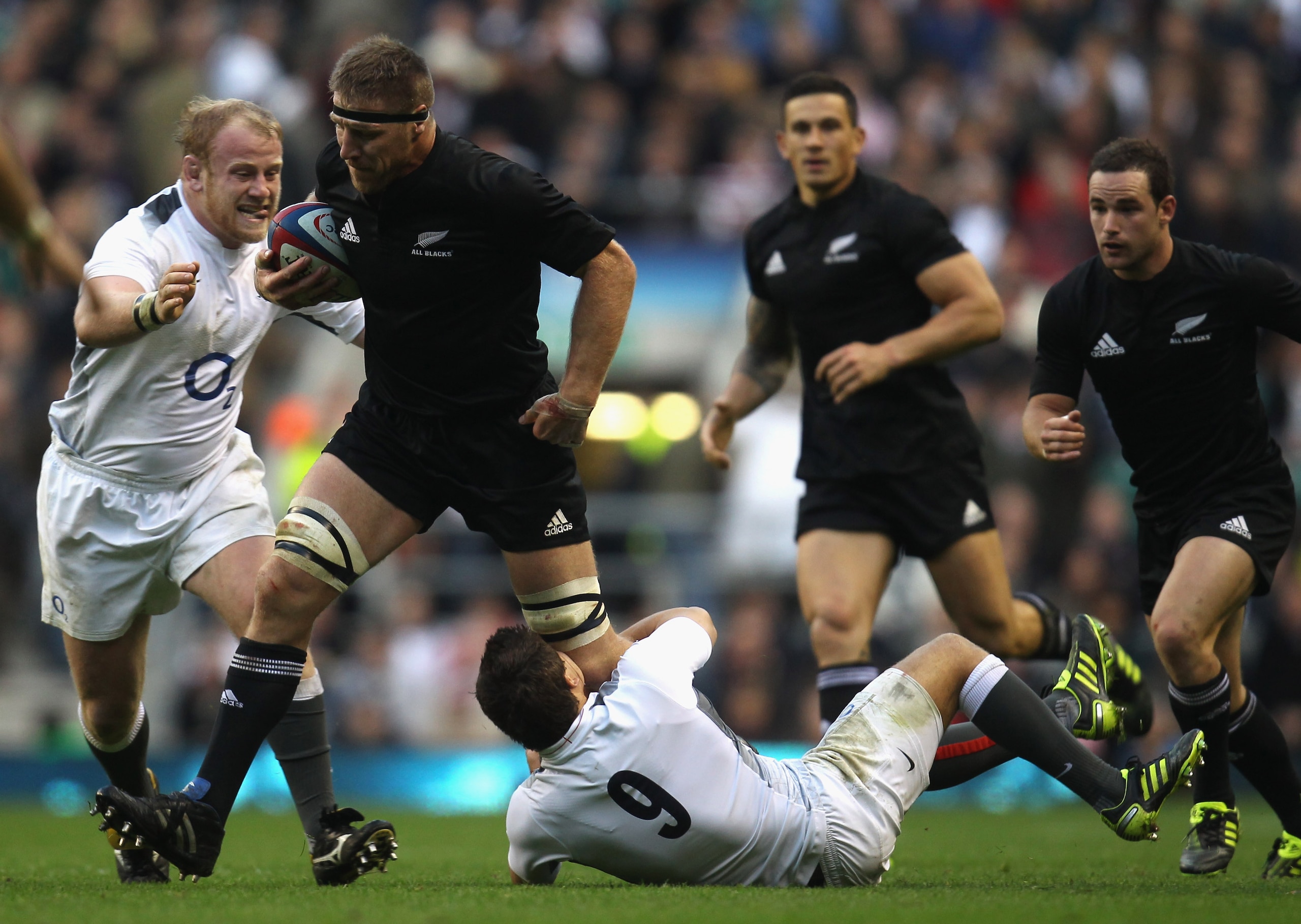 LONDON, ENGLAND - NOVEMBER 06: Brad Thorn of the New Zealand All Blacks is tackled by Ben Youngs of England during the Investec Challenge match between England and New Zealand at Twickenham Stadium on November 6, 2010 in London, England.  (Photo by Phil W