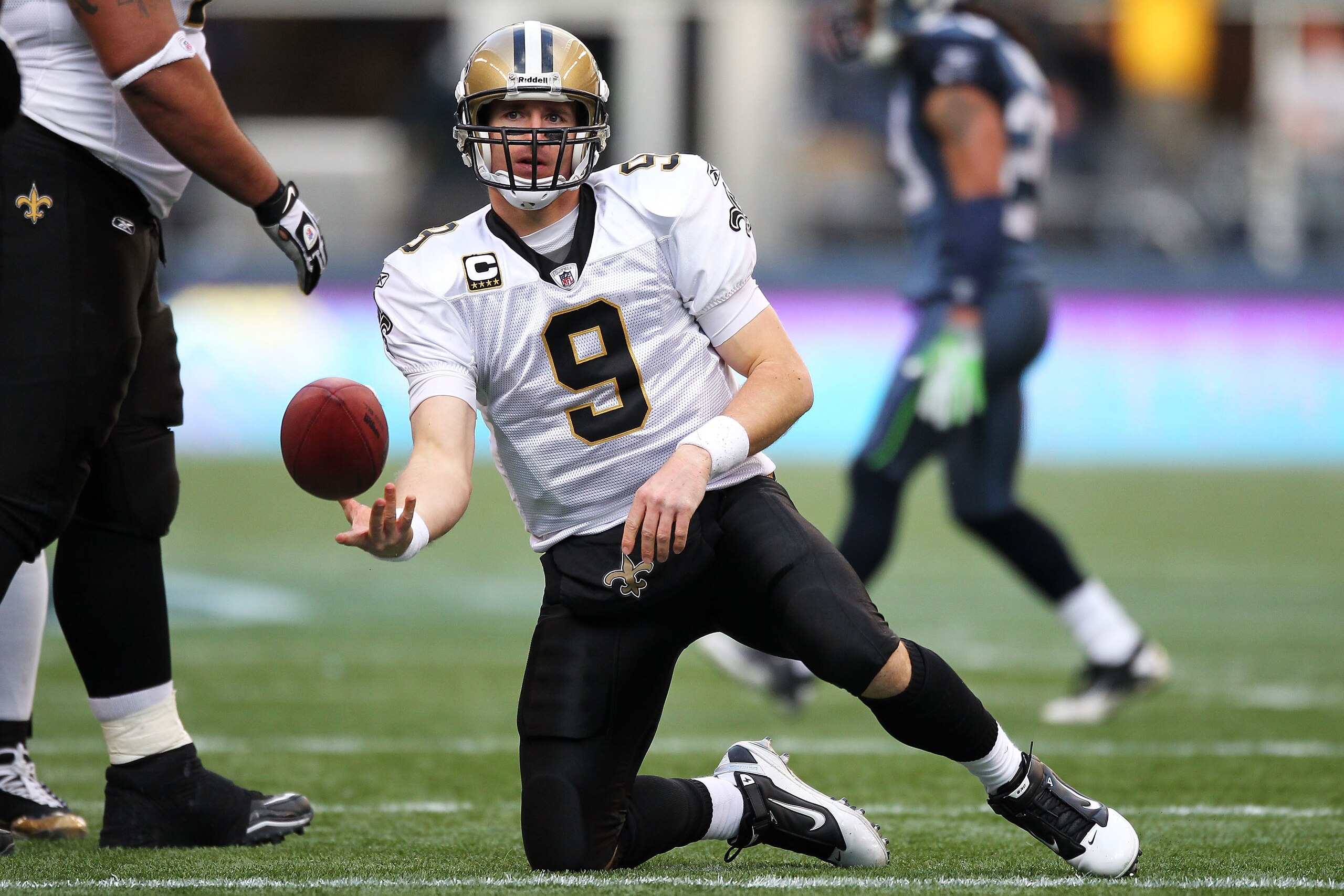 SEATTLE, WA - JANUARY 08:  Drew Brees #9 of the New Orleans Saints gets up after a play against the Seattle Seahawks during the 2011 NFC wild-card playoff game at Qwest Field on January 8, 2011 in Seattle, Washington.  (Photo by Otto Greule Jr/Getty Image