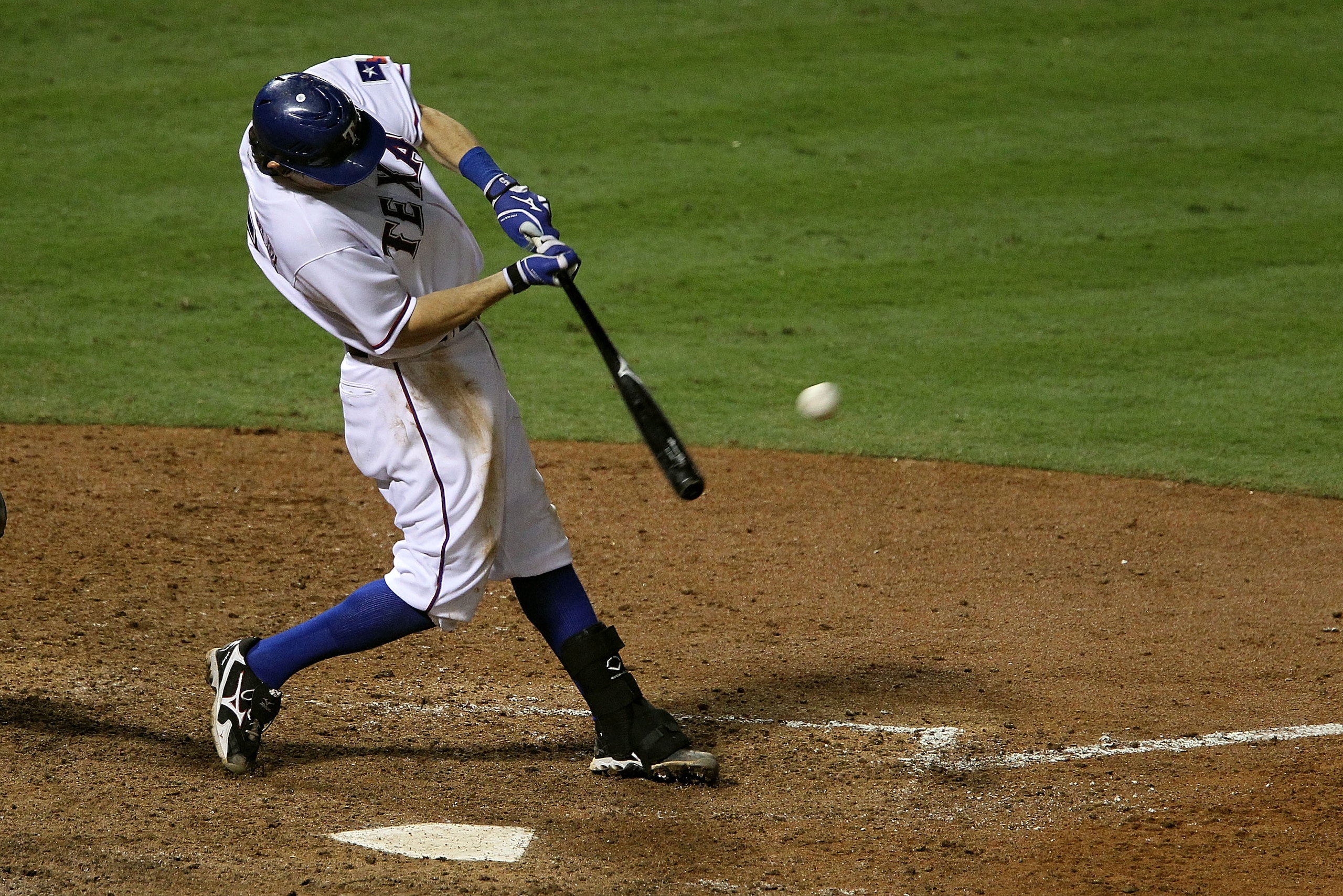 ARLINGTON, TX - OCTOBER 22: Ian Kinsler #5 of the Texas Rangers hits a sacrifice fly to score Michael Young #10 against the New York Yankees in the seventh inning of Game Six of the ALCS during the 2010 MLB Playoffs at Rangers Ballpark in Arlington on Oc ARLINGTON, TX - OCTOBER 22: Ian Kinsler #5 of the Texas Rangers hits a sacrifice fly to score Michael Young #10 against the New York Yankees in the seventh inning of Game Six of the ALCS during the 2010 MLB Playoffs at Rangers Ballpark in Arlington on Oc