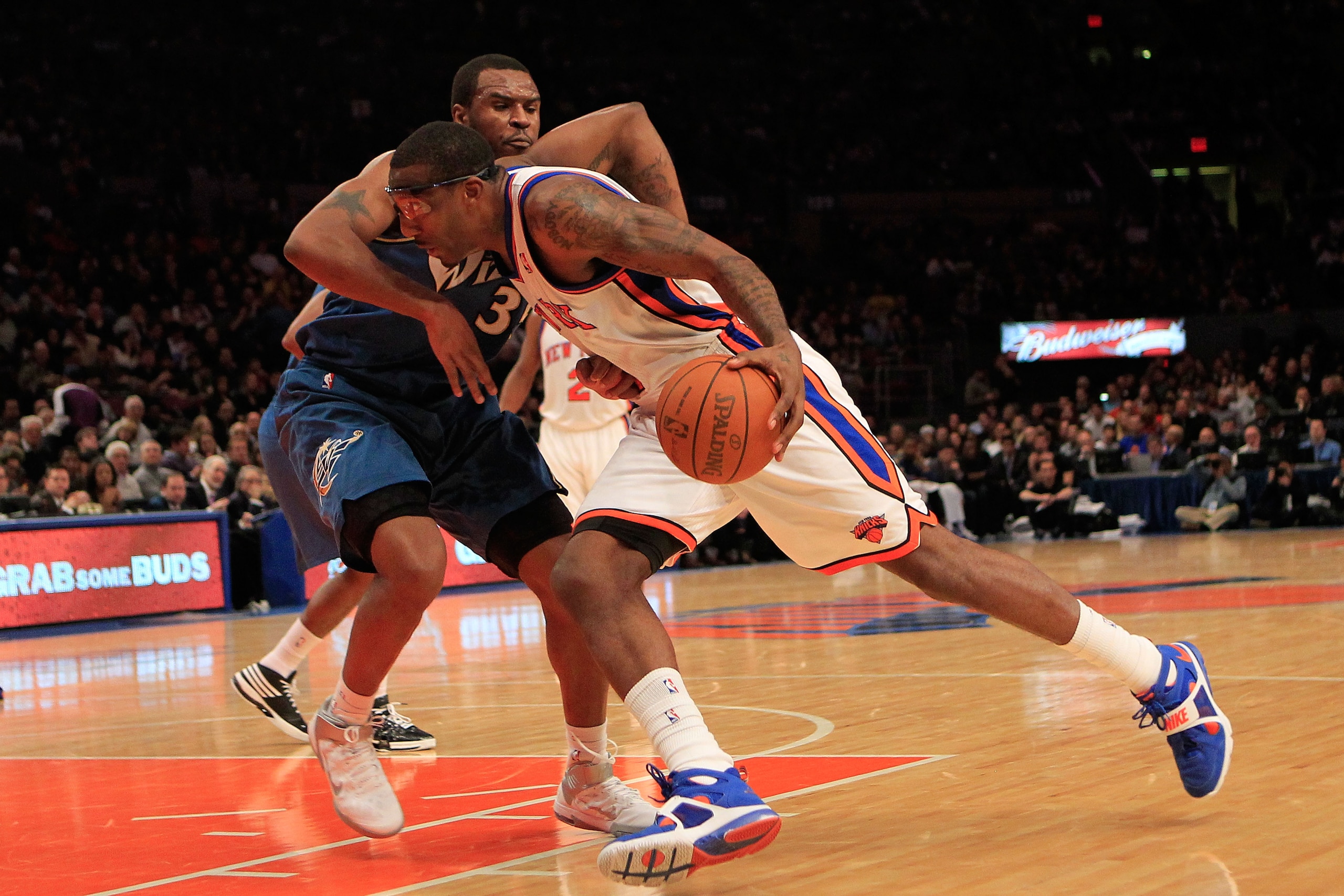 NEW YORK, NY - JANUARY 24: Amar'e Stoudemire #1 of the New York Knicks drives past Trevor Booker #35 of the Washington Wizards at Madison Square Garden on January 24, 2011 in New York City. NOTE TO USER: User expressly acknowledges and agrees that, by dow