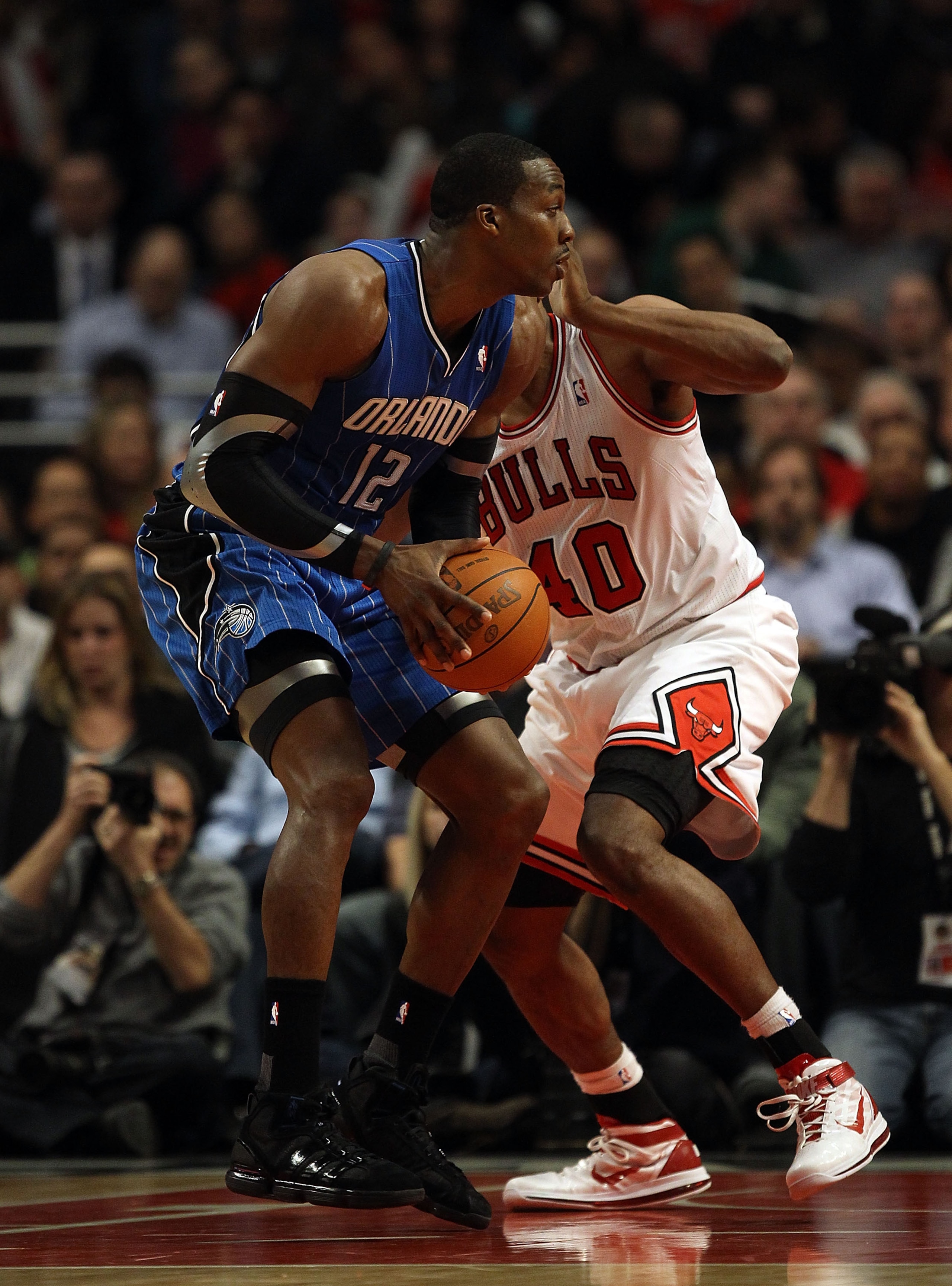 CHICAGO, IL - JANUARY 28: Dwight Howard #12 of the Orlando Magic moves against Kurt Thomas #40 of the the Chicago Bulls at the United Center on January 28, 2011 in Chicago, Illinois. The Bulls defeated the Magic 99-90. NOTE TO USER: User expressly acknowl