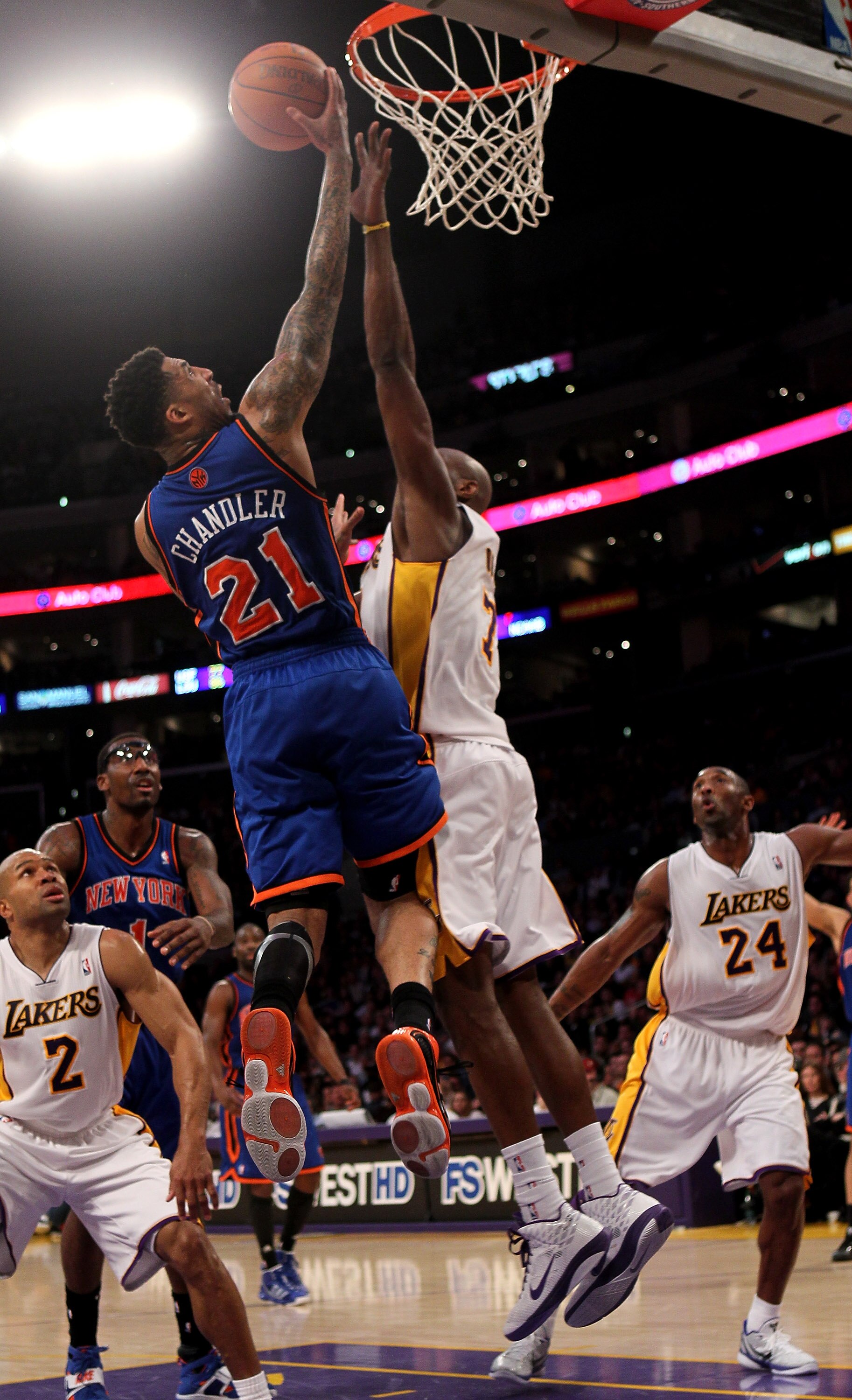 LOS ANGELES, CA - JANUARY 09:  Wilson Chandler #21 of the New York Knicks goes up for a shot over Lamar Odom #7 of the Los Angeles Lakers at Staples Center on January 9, 2011 in Los Angeles, California.  The Lakers won 109-87.   NOTE TO USER: User express