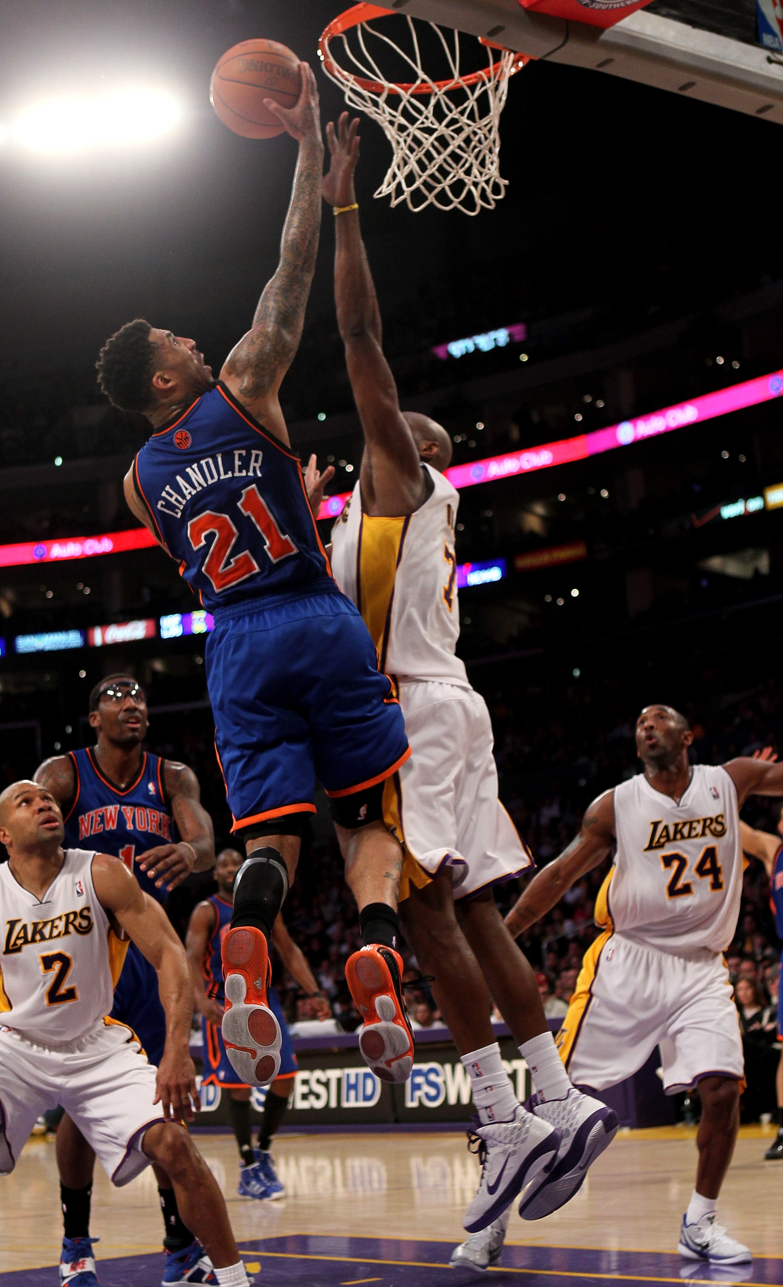 LOS ANGELES, CA - JANUARY 09:  Wilson Chandler #21 of the New York Knicks goes up for a shot over Lamar Odom #7 of the Los Angeles Lakers at Staples Center on January 9, 2011 in Los Angeles, California.  The Lakers won 109-87.   NOTE TO USER: User express