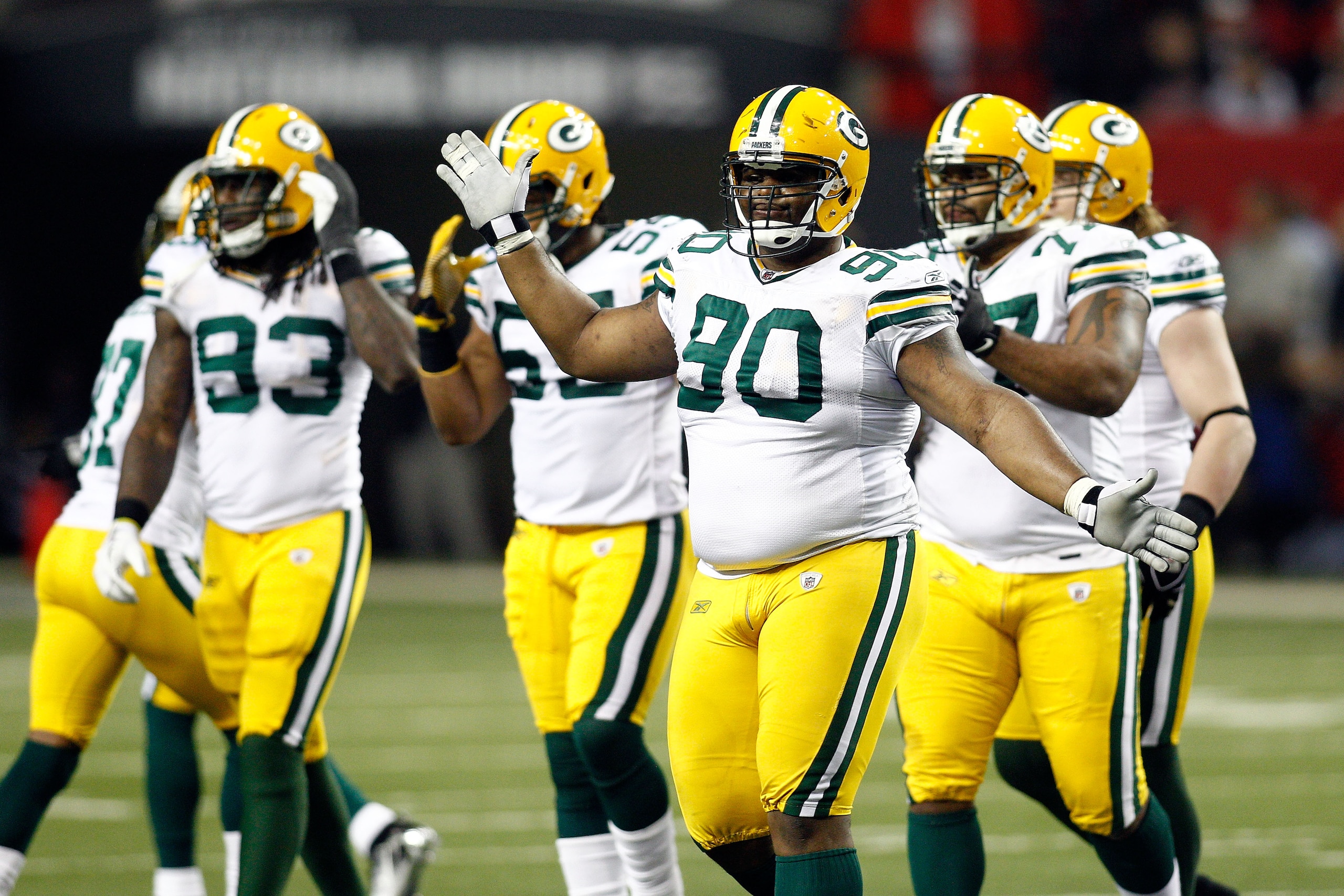 ATLANTA, GA - JANUARY 15:  B.J. Raji #90 of  the Green Bay Packers celebrates a defensive play against the Atlanta Falcons during their 2011 NFC divisional playoff game at Georgia Dome on January 15, 2011 in Atlanta, Georgia.  (Photo by Chris Graythen/Get