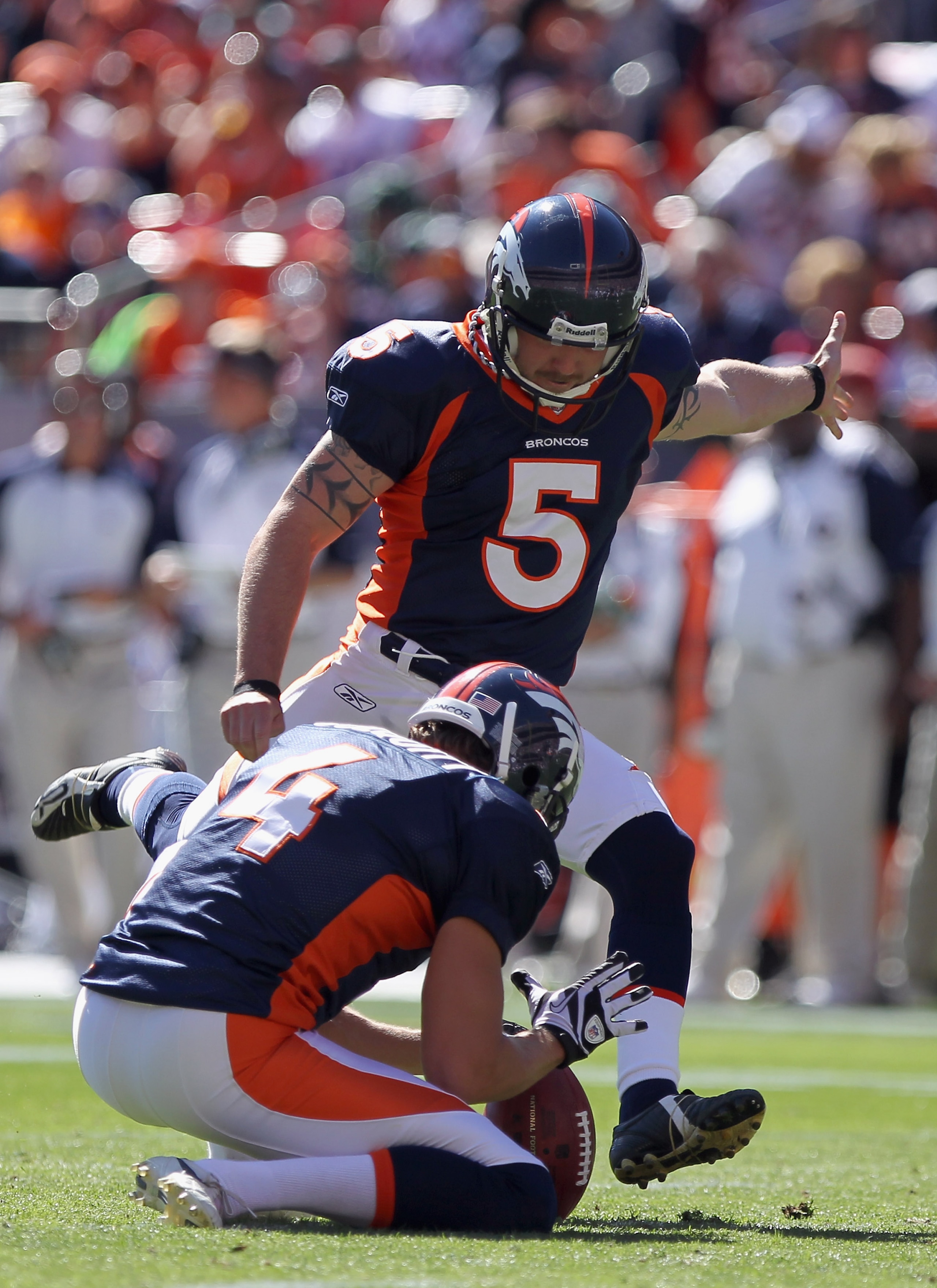 DENVER - SEPTEMBER 19:  Place kicker Matt Prater #5 of the Denver Broncos attempts a field goal from the hold of Britton Colquitt #4 against the Seattle Seahawks at INVESCO Field at Mile High on September 19, 2010 in Denver, Colorado. The Broncos defeated