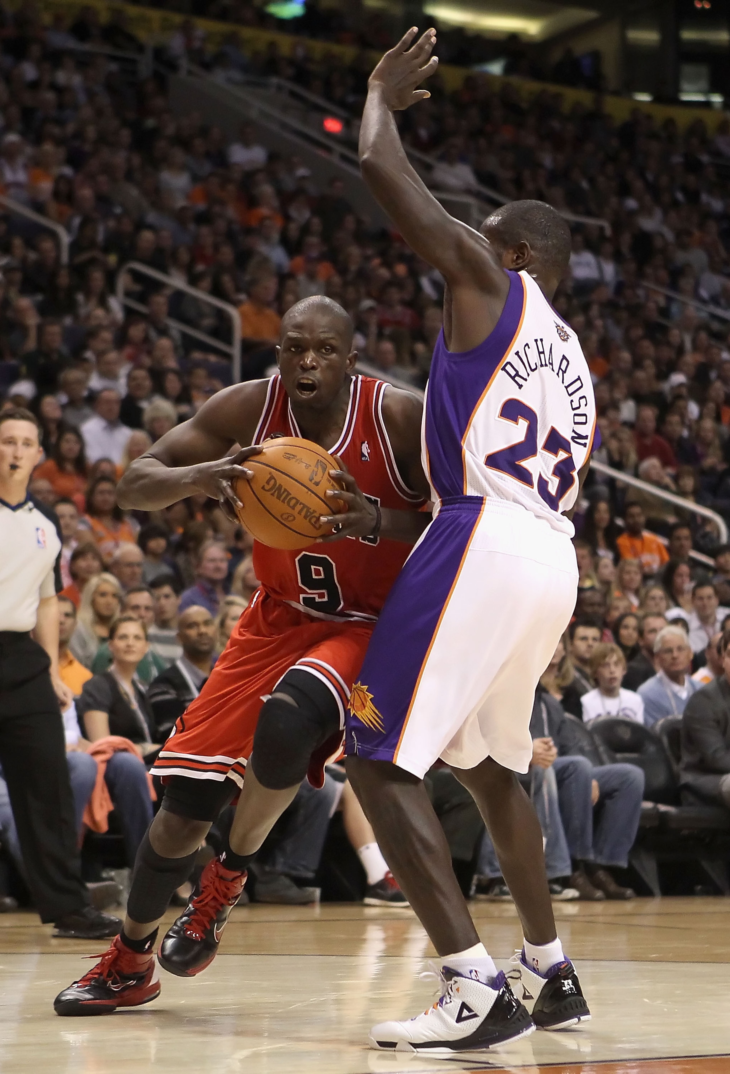 PHOENIX - NOVEMBER 24:  Luol Deng #9 of the Chicago Bulls drives to the basket during the NBA game against the Phoenix Suns at US Airways Center on November 24, 2010 in Phoenix, Arizona. The Bulls defeated the Suns 123-115 in double overtime.  NOTE TO USE